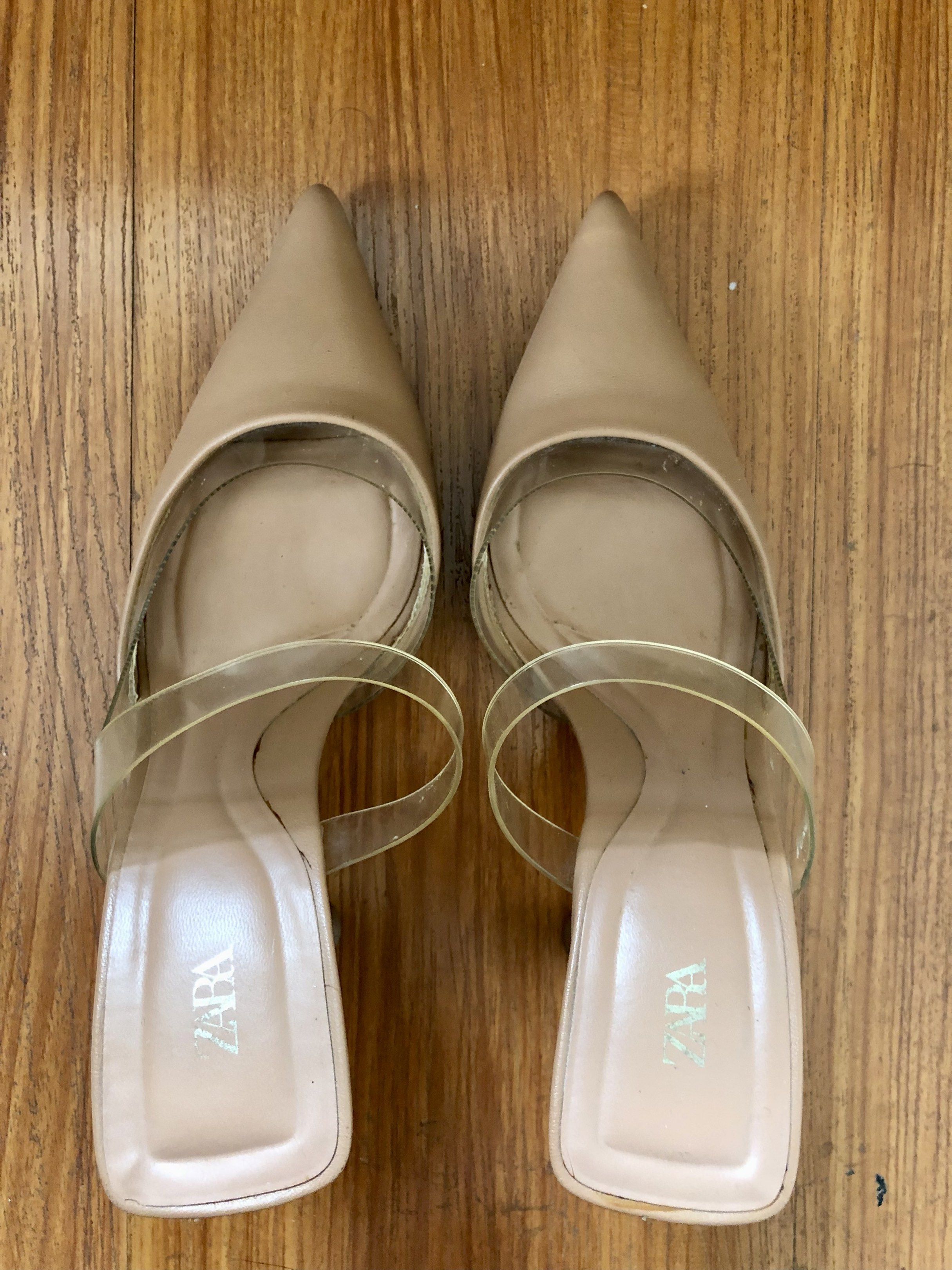 Zara Vinyl High-Heel Mules (Category: Heels) located in Quezon City. Submitted by ayetb (Listing ID 1419843855, Image 2). Description: Zara Vinyl High-Heel Mules Selling price: ₱520 Purchased from Zara store at ₱2,795 Condition: Pre-loved. The clear heel shows signs of wear, including visible scratches and some discoloration/oxidation inside the heel. Upper and sole are still usable, but please manage expectations. Reason for selling: Declutterin