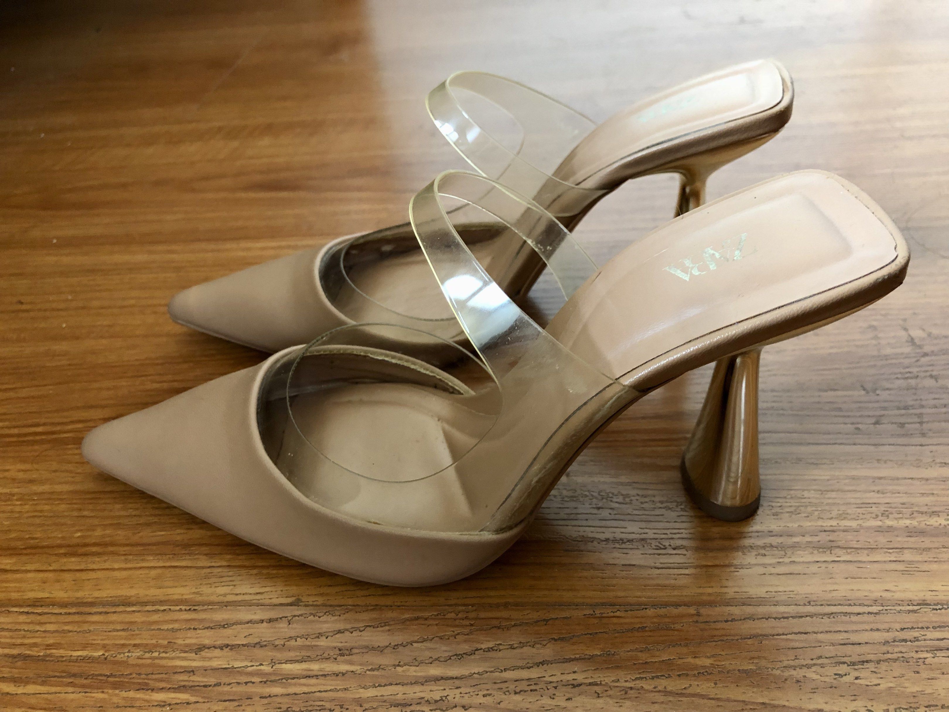 Zara Vinyl High-Heel Mules (Category: Heels) located in Quezon City. Submitted by ayetb (Listing ID 1419843855, Image 1). Description: Zara Vinyl High-Heel Mules Selling price: ₱520 Purchased from Zara store at ₱2,795 Condition: Pre-loved. The clear heel shows signs of wear, including visible scratches and some discoloration/oxidation inside the heel. Upper and sole are still usable, but please manage expectations. Reason for selling: Declutterin