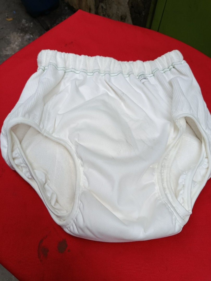 Adult Diapers cloth 3 pcs (Category: Diapers & Baby Wipes) located in Quezon City. Submitted by bernadette_puyos16 (Listing ID 1420040024, Image 2). Description: - Adult diaper, size L- XL - Unused and in original packaging - Elastic waistband with green stitching - Soft, absorbent inner lining - Size and product code visible on tag.