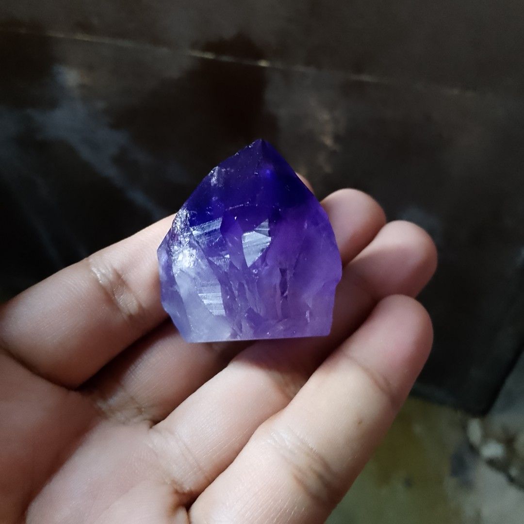 Amethyst Crystal Point (Category: Other Home Decor) located in Manila. Submitted by arn_thrifts (Listing ID 1420031022, Image 2). Description: - Genuine amethyst crystal point - Rich, deep purple hue with lighter variations - Natural, uncut crystal - Pointed top - Displays a lovely shine - Well-formed crystal.