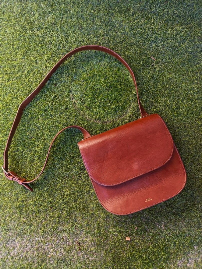APC Christie Brown Leather Shoulder Bag (Category: Luxury Bags & Wallets) located in General Santos City (Dadiangas). Submitted by j_archives (Listing ID 1420027368, Image 1). Description: - APC brown leather shoulder bag - Flap closure with magnetic snap - Adjustable shoulder strap - Zippered interior pocket - Gold-tone buckle - Light beige fabric lining - Made in Tunisia - Classic, minimalist design.