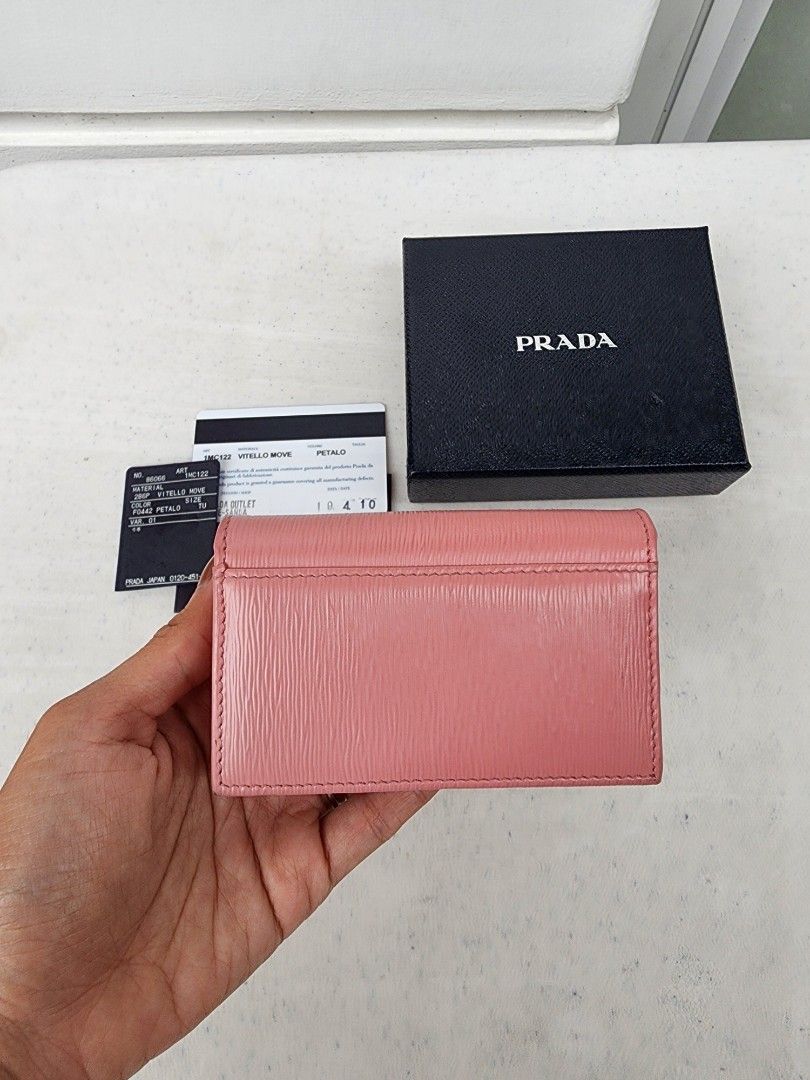 Auth Prada Saffiano Pink Card Holder (Category: Luxury Bags & Wallets) located in Muntinlupa City. Submitted by trishdlf (Listing ID 1420024682, Image 3). Description: Auth Prada Flap Cardholder in Pink Saffiano Leather Gold Hardware Very Good 9/10 Cond Purchased in Japan Current retail at $595 Inclusions: Box and Cards RFS: Decluttering MOP: BPI only Meet-ups: Alabang (weekends) or Makati (weekdays) SF c/o buyer.