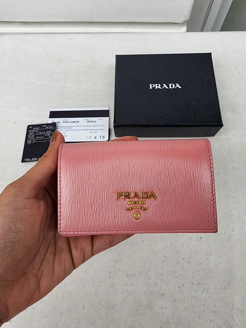 Auth Prada Saffiano Pink Card Holder (Category: Luxury Bags & Wallets) located in Muntinlupa City. Submitted by trishdlf (Listing ID 1420024682, Image 2). Description: Auth Prada Flap Cardholder in Pink Saffiano Leather Gold Hardware Very Good 9/10 Cond Purchased in Japan Current retail at $595 Inclusions: Box and Cards RFS: Decluttering MOP: BPI only Meet-ups: Alabang (weekends) or Makati (weekdays) SF c/o buyer.