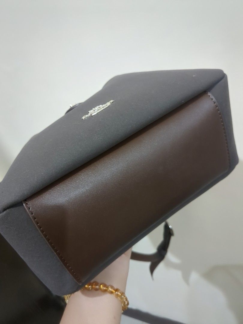 Authentic Coach Hadley Convertible Bag (Category: Luxury Bags & Wallets) located in Las Pinas. Submitted by luxlahvu2017 (Listing ID 1420120310, Image 3). Description: - Coach shoulder bag - Dark gray color - Secure flap closure with silver-tone buckle - Interior zipper pocket - Comfortable shoulder strap - Subtle Coach logo - Perfect for everyday use.
