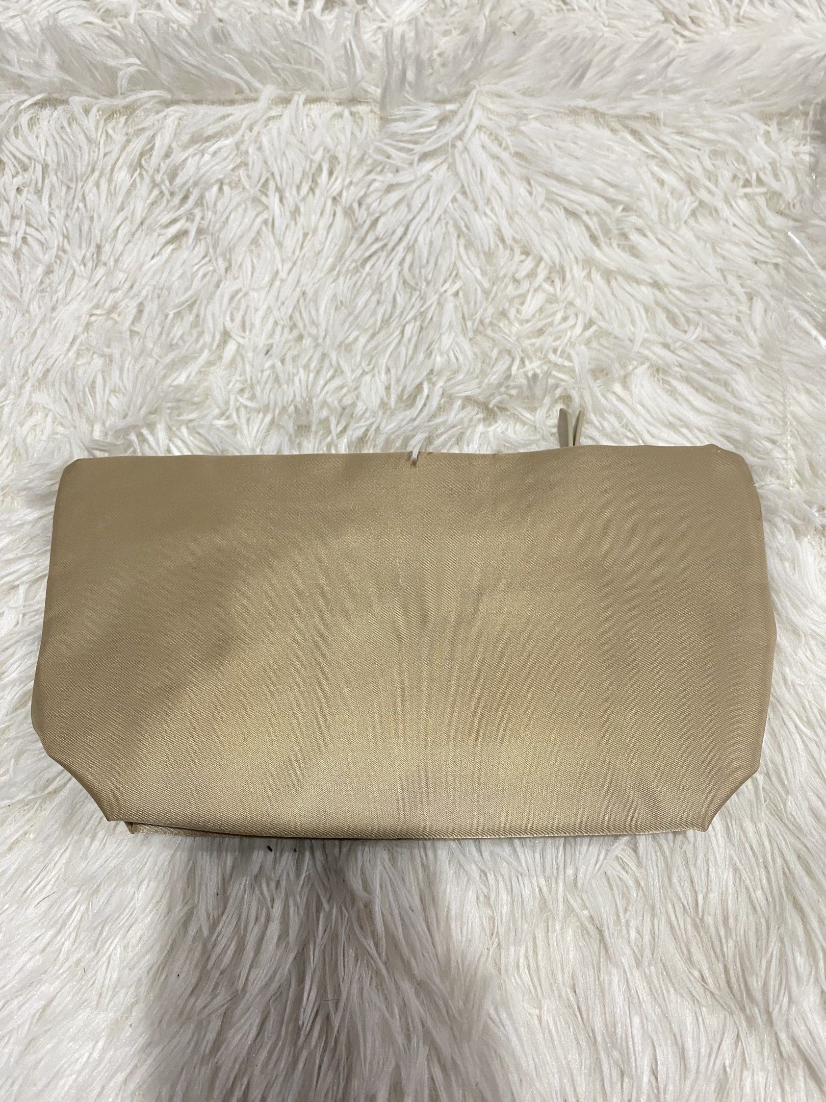 Burberry Beige Clutch (Category: Luxury Bags & Wallets) located in Manila. Submitted by motscollections041421 (Listing ID 1420016231, Image 2). Description: - Authentic Burberry clutch - Color: Beige - Closure: Zipper - Interior: Small pocket and Burberry logo lining - Materials: 100% polyester (body and trim), 90% polyester/10% cotton (lining) - Made in China.