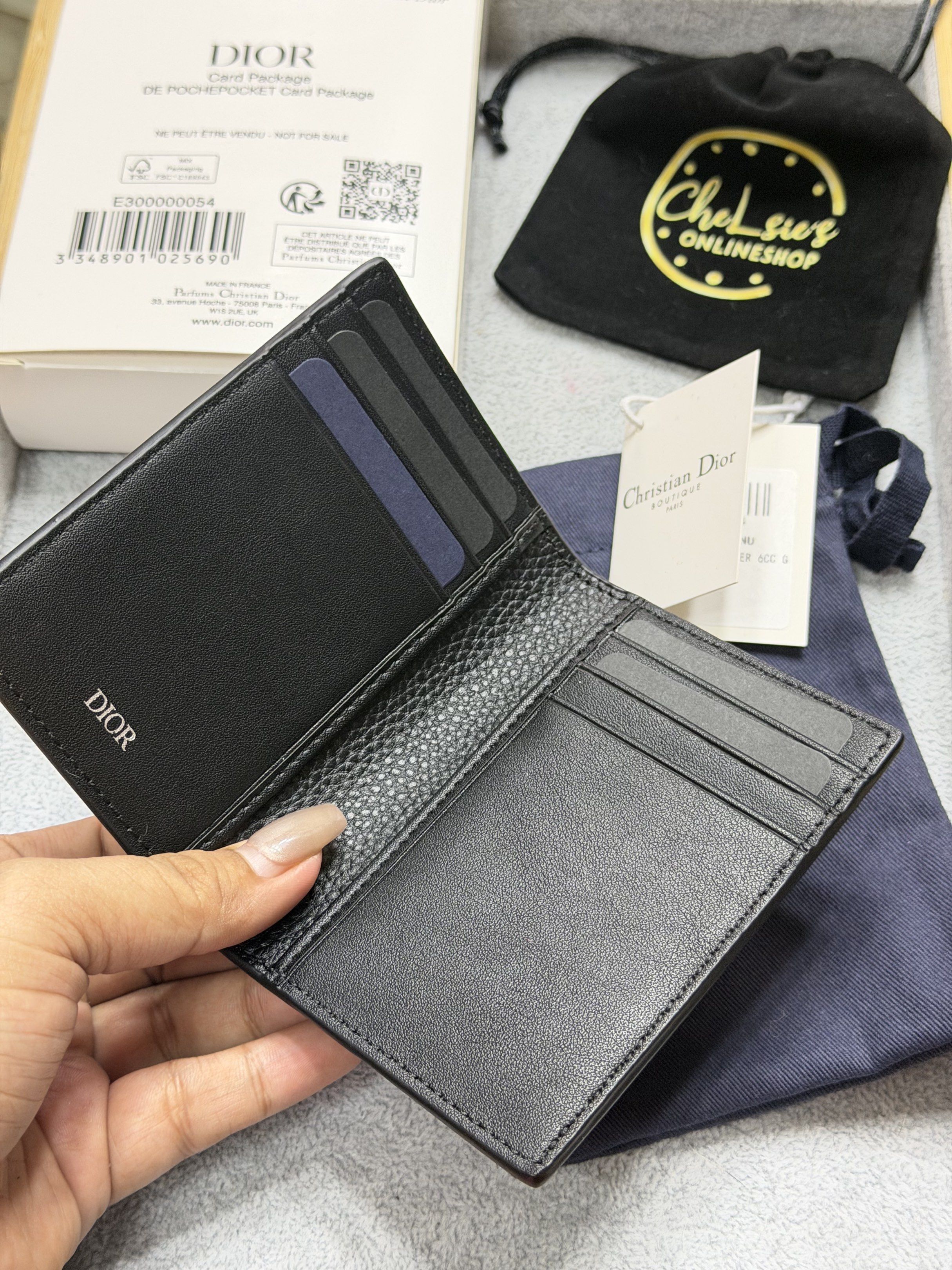 Christian Dior Black Leather Card Holder (Category: Luxury Bags & Wallets) located in Quezon City. Submitted by chelsie_shopph (Listing ID 1420136902, Image 2). Description: - Authentic Christian Dior card holder - Black leather with CD logo - Includes original box, dust bag, and authenticity card - Made in France - Perfect for cards and cash - Stylish and practical.