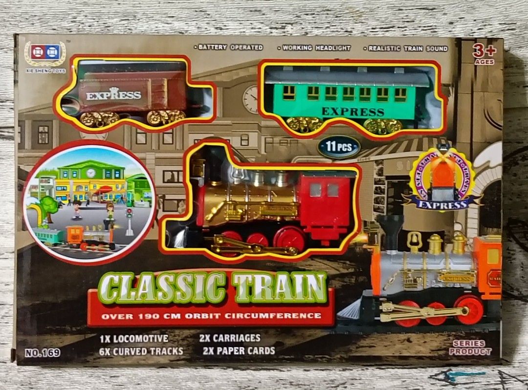 Classic Train Set with Tracks (Category: Vehicle & Diecast Models) located in Pasig City. Submitted by benildarustia18 (Listing ID 1420003370, Image 1). Description: - Rail King Train Set - Includes locomotive, carriages, and curved tracks - Working headlight - Realistic train sound - Over 190 cm orbit circumference - 11-piece set - Includes paper cards.