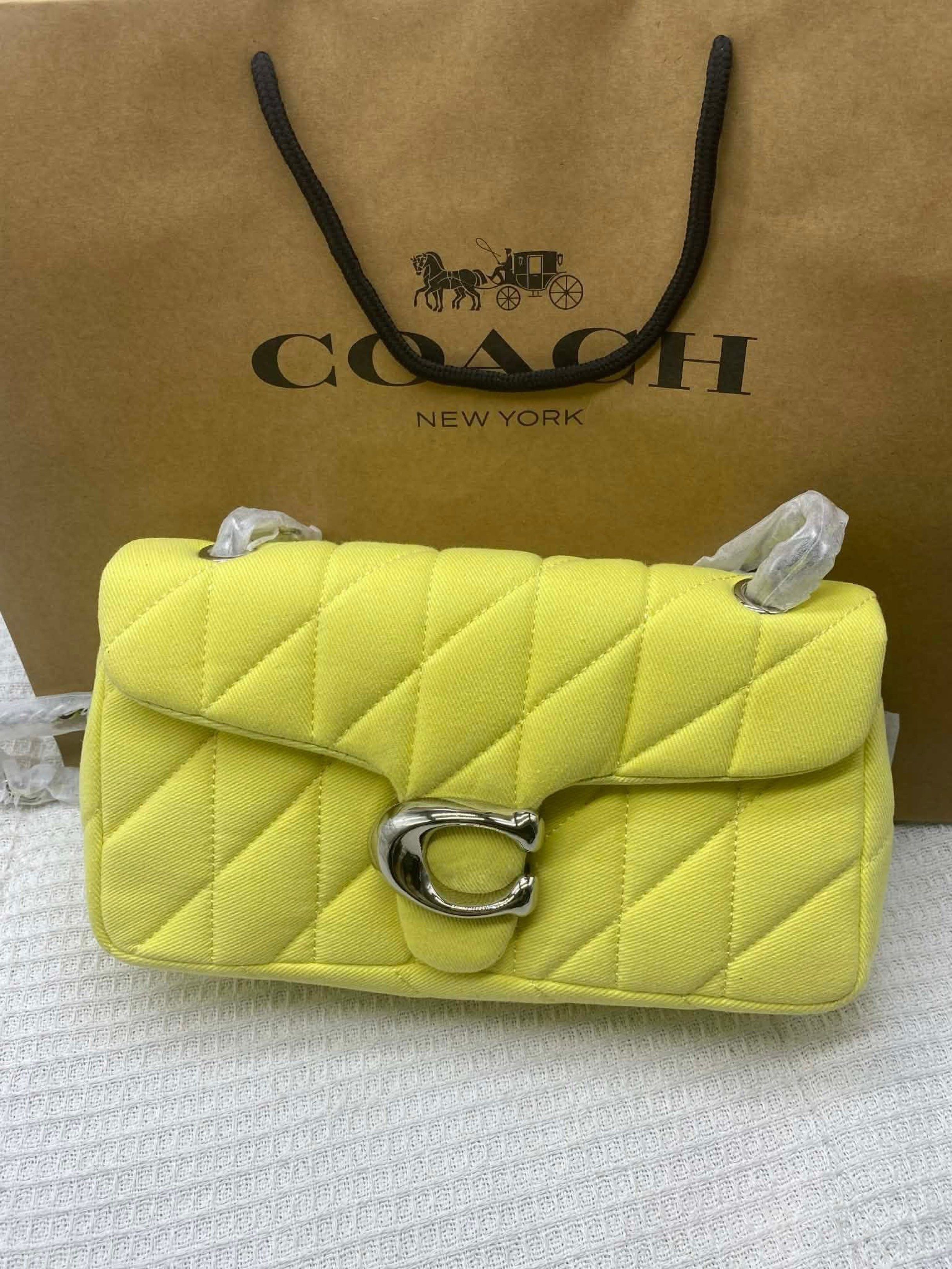 Coach Pillow Tabby Shoulder Bag (Category: Luxury Bags & Wallets) located in Manila. Submitted by clairetot (Listing ID 1420093430, Image 1). Description: - Coach Pillow Tabby Shoulder Bag - Quilted design - Signature C clasp - Chain strap included - Detachable shoulder strap - Comes with Coach paper bag - Available colors: Yellow, Brown Buy 1 get one .