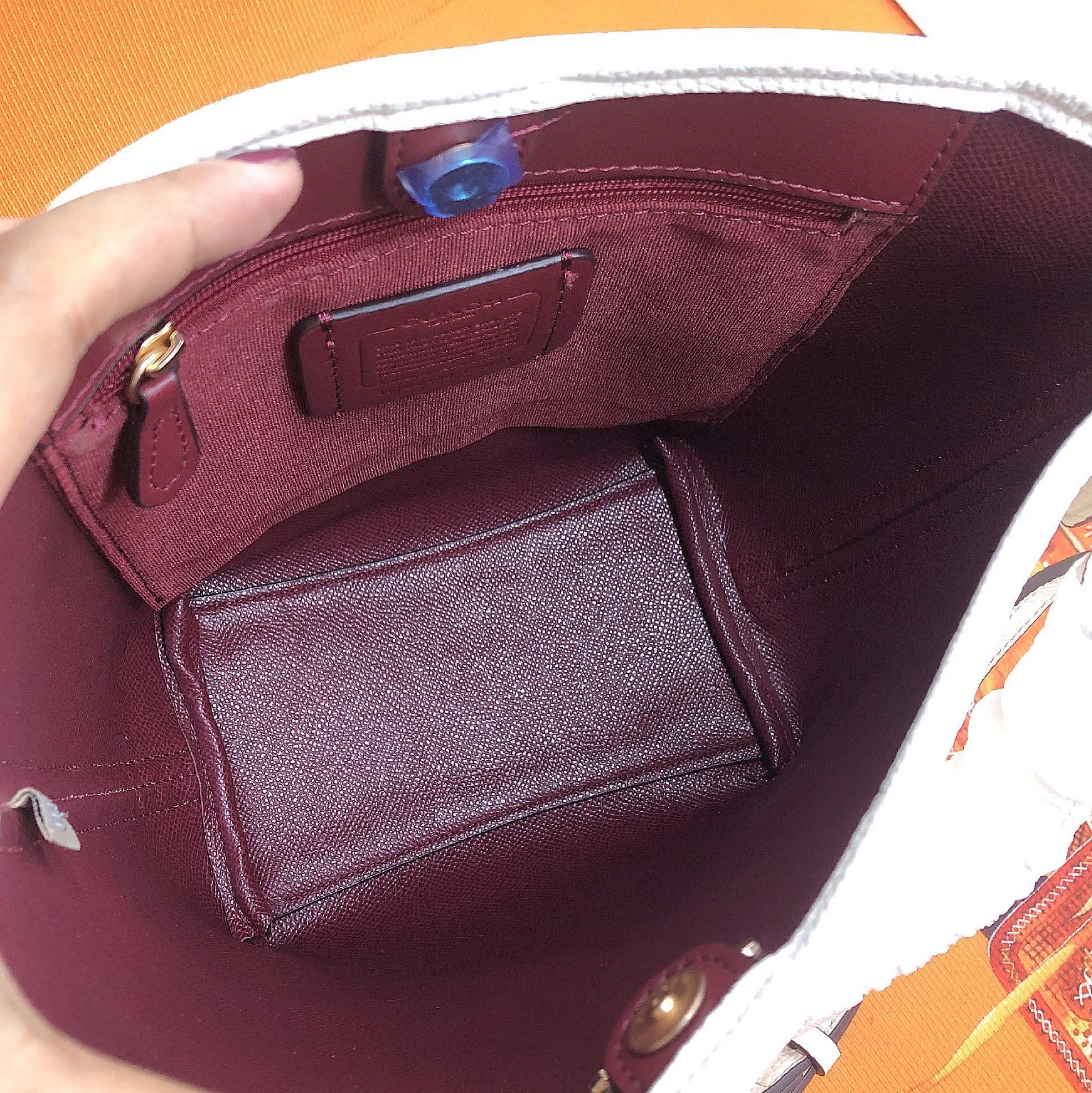 Coach White Bucket Bag (Category: Luxury Bags & Wallets) located in Manila. Submitted by clairetot (Listing ID 1420092005, Image 2). Description: Coach bucket bag in white. Features a gold logo, detachable strap, and drawstring closure. Includes Coach tag with model number C2480-CT801..
