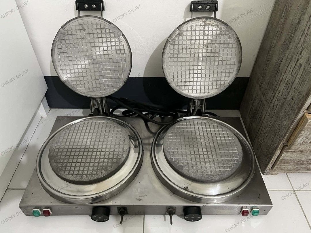 Commercial Double Waffle Maker (Category: Other Kitchen Appliances) located in Rizal. Submitted by danicahpangilinan (Listing ID 1420106689, Image 2). Description: -Commercial-grade double waffle maker. -Features two round 7-inches diameter waffle plates - Includes individual temperature controls and power indicator lights. Made of stainless steel -Includes a power cord -Perfect for commercial use like cafes or restaurants -Antipolo Location.