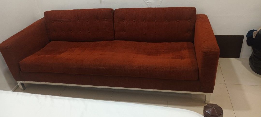 Deep Orange Fabric Sofa with Metal Legs (Category: Sofas) located in Mandaluyong City. Submitted by bestill4610 (Listing ID 1420121729, Image 1). Description: - Beautiful Modern 3-seater sofa - Two-cushion backrest with button detailing - Comfortable seating area - Sturdy metal legs - L 215cm x D 90cm - Purchased at Store One RESTORATION Furniture Store at Shangrila Mall - Issues: Missing buttons. Needs deep cleaning. Seat medyo lubog..