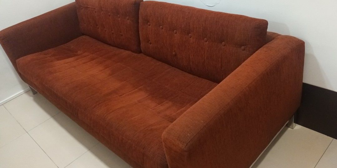Deep Orange Fabric Sofa with Metal Legs (Category: Sofas) located in Mandaluyong City. Submitted by bestill4610 (Listing ID 1420121729, Image 2). Description: - Beautiful Modern 3-seater sofa - Two-cushion backrest with button detailing - Comfortable seating area - Sturdy metal legs - L 215cm x D 90cm - Purchased at Store One RESTORATION Furniture Store at Shangrila Mall - Issues: Missing buttons. Needs deep cleaning. Seat medyo lubog..