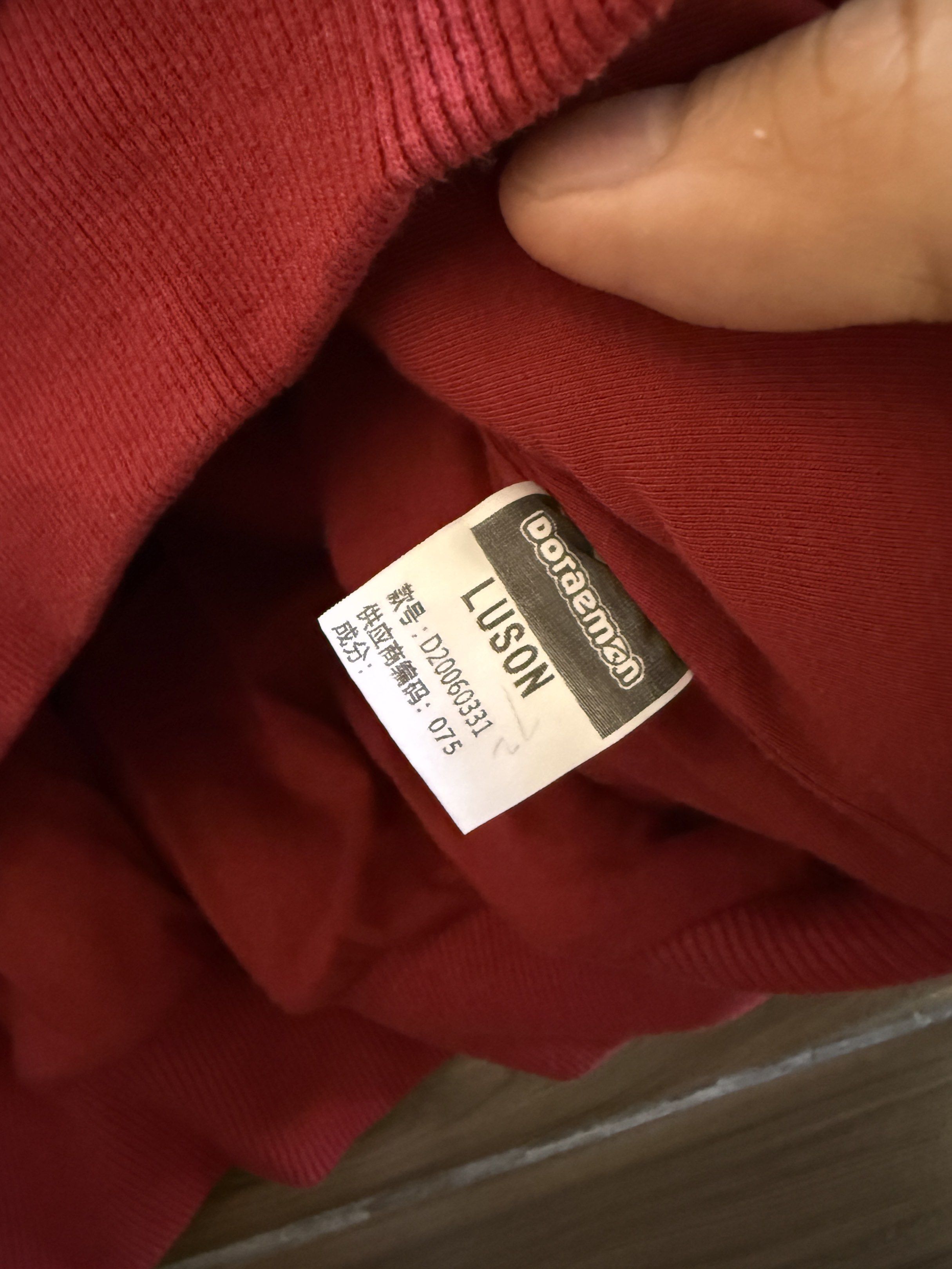 Doraemon Fleece Hoodie XL (Category: Hoodies) located in Manila. Submitted by zerachiel_ (Listing ID 1419991136, Image 3). Description: - Doraemon fleece hoodie - Deep red color - Features a large Doraemon graphic - Size: XL - Brand: Luson - With hood and ribbed cuffs/hem - Perfect for Doraemon fans.