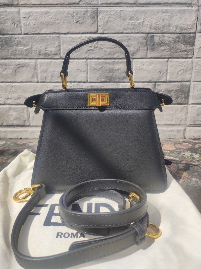 Fendi Peekaboo Mini Black Leather Bag (Category: Luxury Bags & Wallets) located in Iloilo. Submitted by ariadnas_shop.ph (Listing ID 1420085668, Image 1). Description: Preloved Black Fendi Peekaboo Mini handbag. Features top handle, detachable shoulder strap, and gold-tone hardware. Includes dust bag. Very Good Condition shipping via J&T, LBC ( COP) payment via BPI, GCASH, MAYA, PALAWAN PAY, PM us first before placing your order .