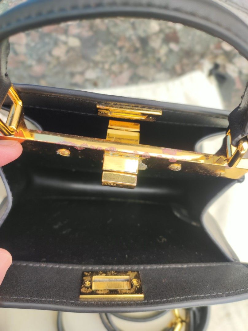 Fendi Peekaboo Mini Black Leather Bag (Category: Luxury Bags & Wallets) located in Iloilo. Submitted by ariadnas_shop.ph (Listing ID 1420085668, Image 3). Description: Preloved Black Fendi Peekaboo Mini handbag. Features top handle, detachable shoulder strap, and gold-tone hardware. Includes dust bag. Very Good Condition shipping via J&T, LBC ( COP) payment via BPI, GCASH, MAYA, PALAWAN PAY, PM us first before placing your order .