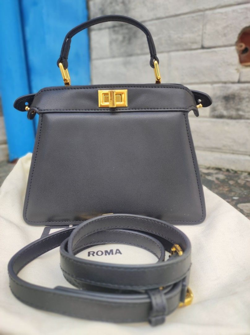 Fendi Peekaboo Mini Black Leather Bag (Category: Luxury Bags & Wallets) located in Iloilo. Submitted by ariadnas_shop.ph (Listing ID 1420085668, Image 2). Description: Preloved Black Fendi Peekaboo Mini handbag. Features top handle, detachable shoulder strap, and gold-tone hardware. Includes dust bag. Very Good Condition shipping via J&T, LBC ( COP) payment via BPI, GCASH, MAYA, PALAWAN PAY, PM us first before placing your order .