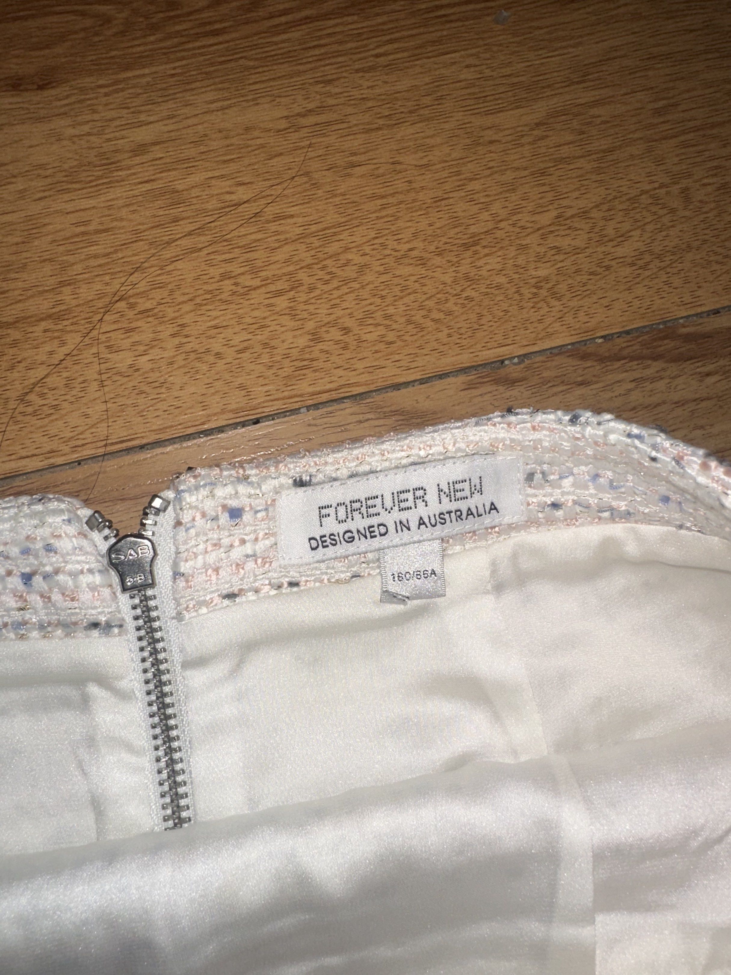 Forever New Tweed Skirt (Category: Skirts) located in Mandaluyong City. Submitted by savinggracetheshopaholic (Listing ID 1420129590, Image 2). Description: - Forever New skirt - Designed in Australia - Tweed fabric - Size: 160/66A - Features a zipper back closure - Satin lining - w 28 - L 17.
