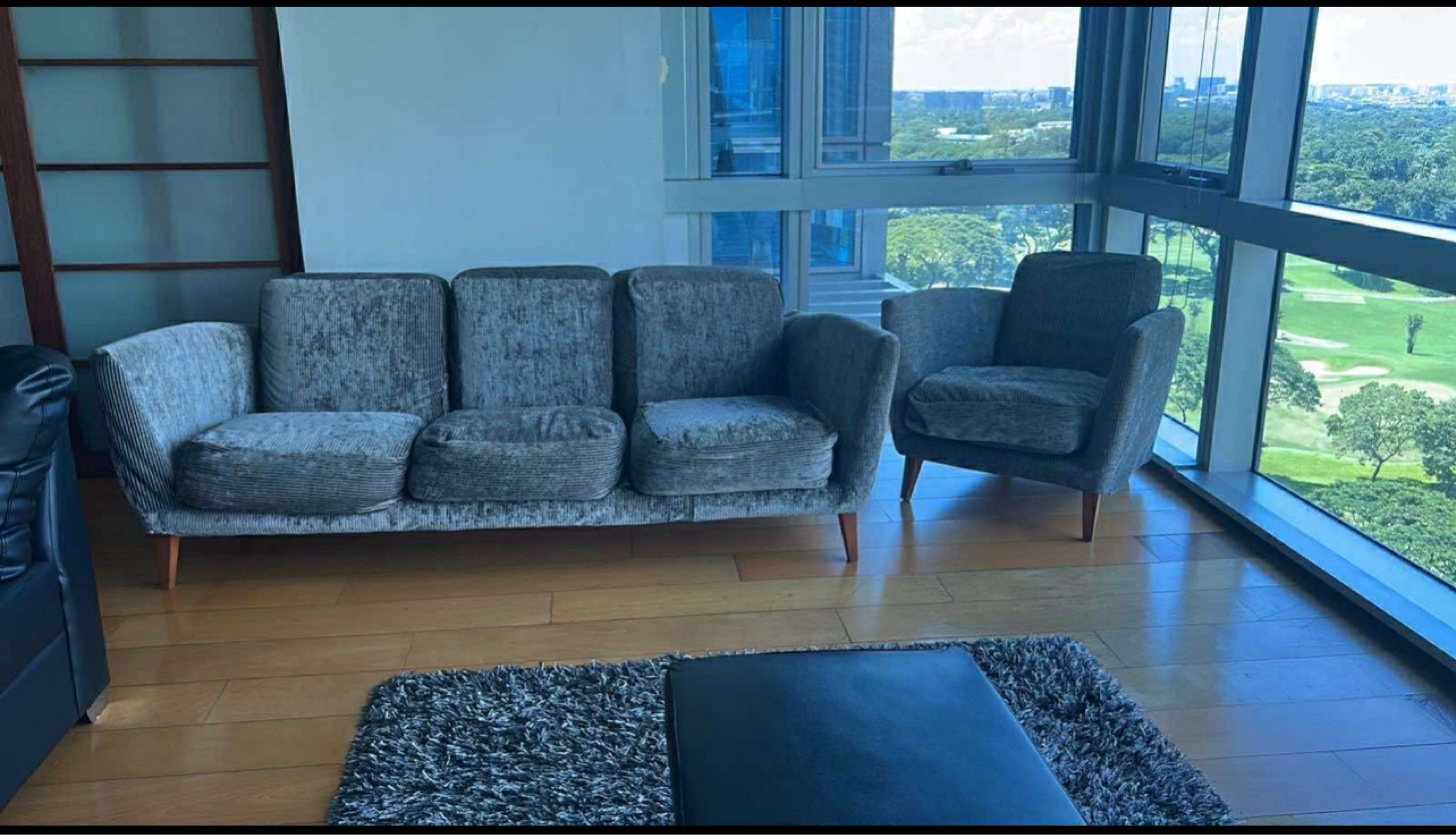 Gray Fabric Sofa and Armchair Set (Category: Sofas) located in Malolos. Submitted by alexissromina (Listing ID 1420013413, Image 1). Description: -PREMIUM SOFA SET FOR SALE (1 LONG 3 SEATER & 2 SIDE CHAIR) -BOUGHT AT 60k yours at 10k!! -ONLY 2.5 YEARS USED ONLY -RFS: lilipat bahay -pls dont bargain anymore, this is such a steal for a premium sofa set - Gray fabric sofa set - Includes a three-seater sofa and armchair - Features wooden legs - Comfo