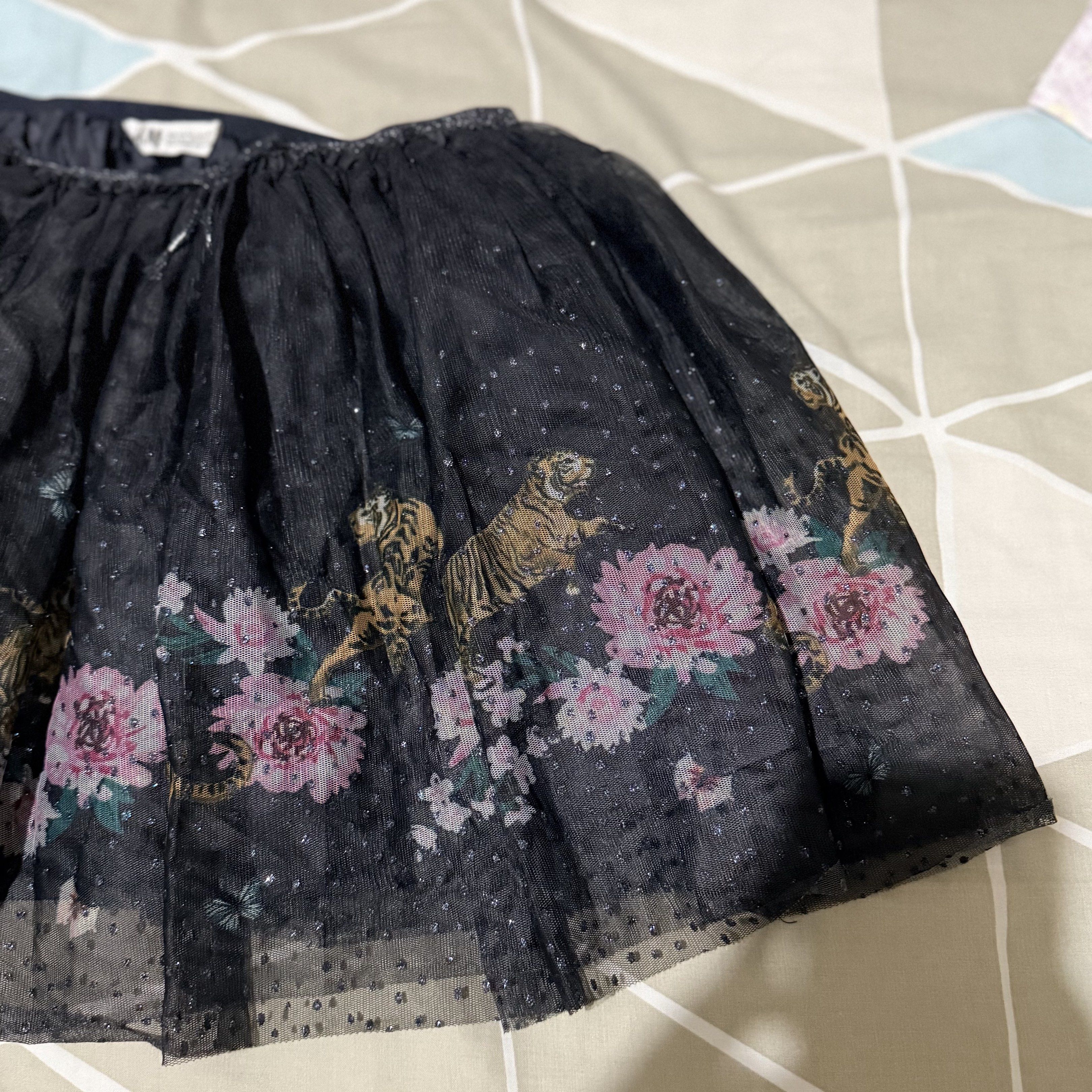 H&M Girls' Tulle Skirt (Category: Babies & Kids Fashion) located in Quezon City. Submitted by ninyacecaco (Listing ID 1420081221, Image 3). Description: - Adorable H&M tulle skirt for girls - Features a beautiful floral and tiger print - Comfortable elastic waistband - Size: EUR 134/140, US 8-10Y, CA 8-10A, MX 134/140, AUS 9-10 - Perfect for special occasions or everyday wear.