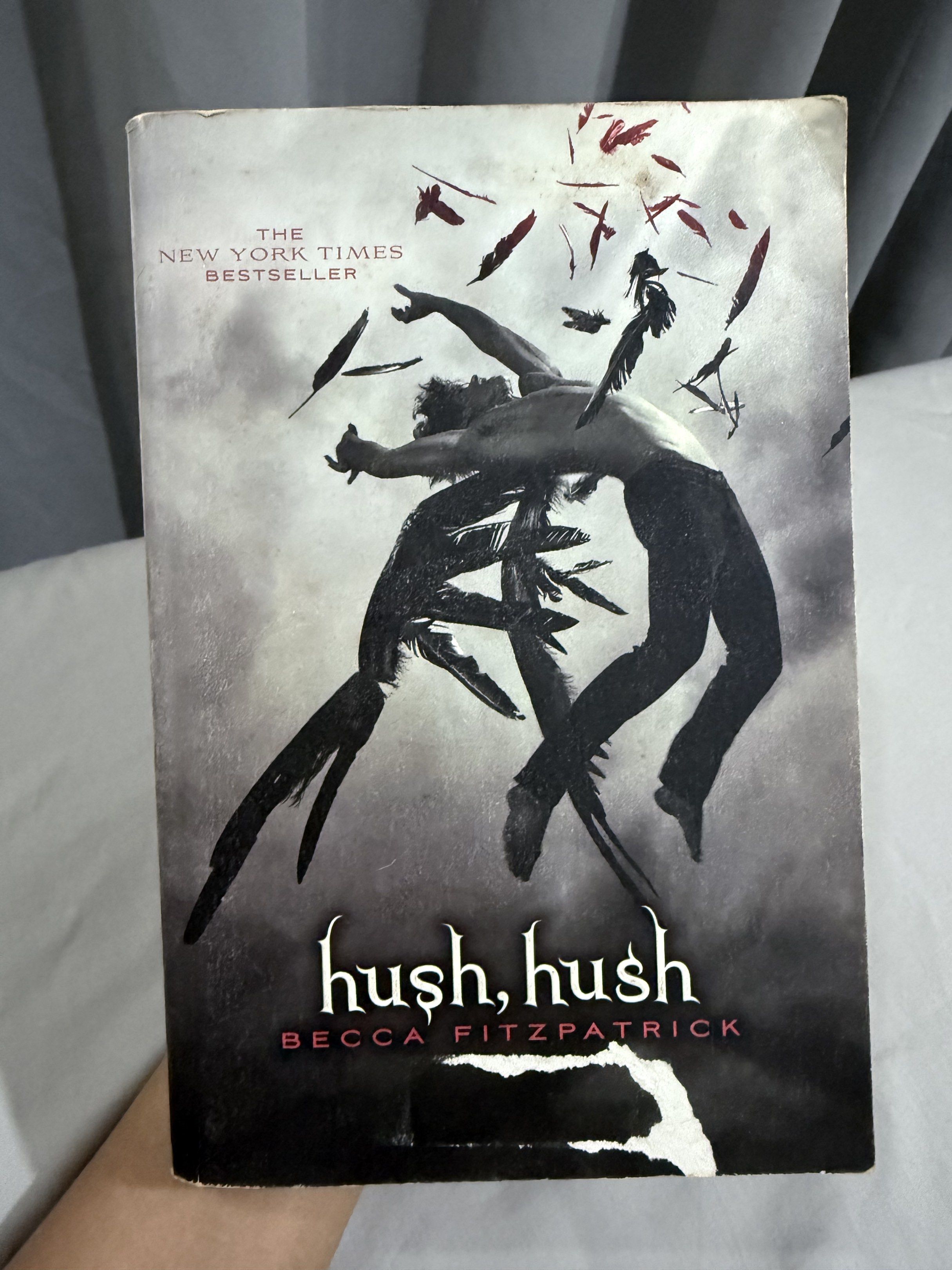 Hush, Hush by Becca Fitzpatrick (Category: Storybooks) located in Mansalay. Submitted by declutterandco (Listing ID 1420117263, Image 1). Description: - Hush, Hush by Becca Fitzpatrick - New York Times Bestseller - Cover art: Dark image with figures and feathers - Condition: Shows wear and tear on edges.