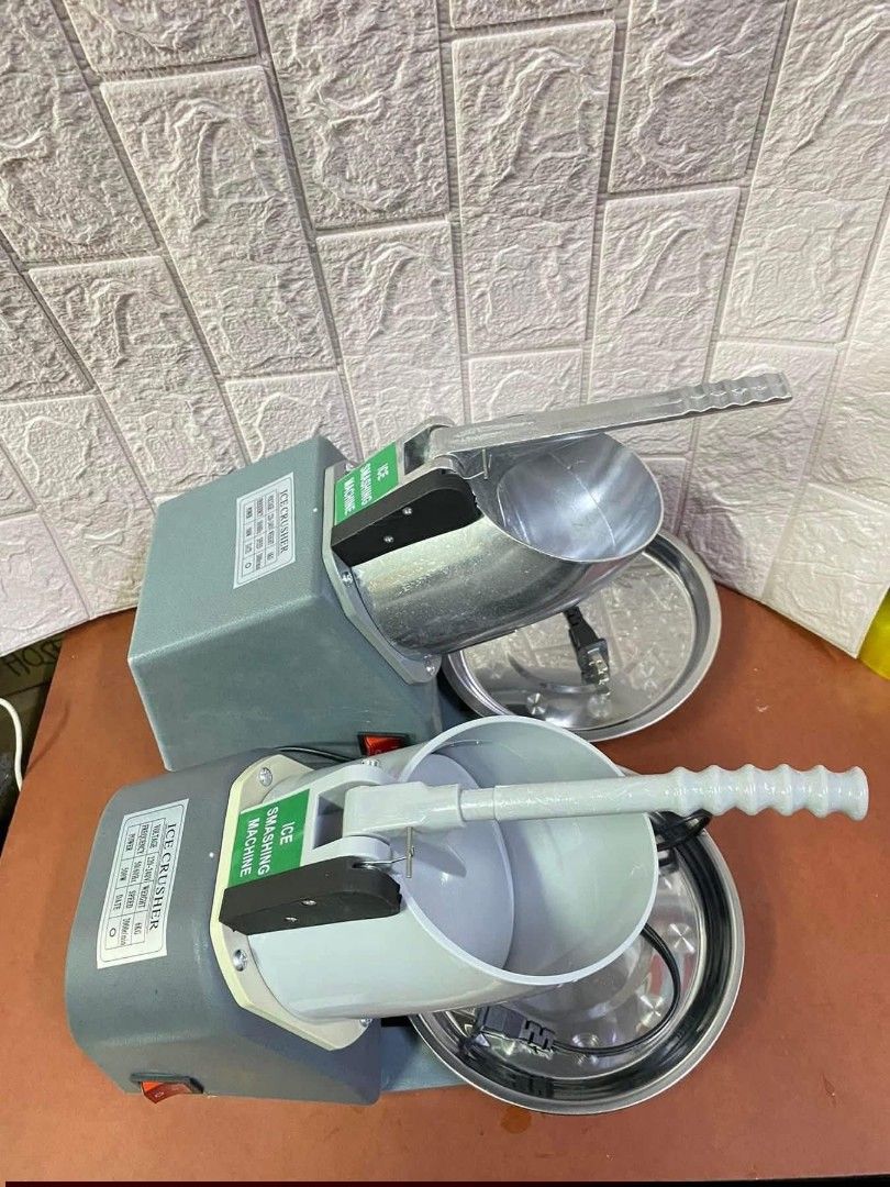 Ice Smashing Machine - Small Plastic and Big Stainless (Category: Everything Else Others) located in Manila. Submitted by jelai.cybyb (Listing ID 1419984550, Image 3). Description: - Available in two variants: small plastic and big stainless. - Both machines feature a gray body and a red power switch. - Small plastic version: plastic ice holder and handle. - Big stainless version: stainless steel ice holder and handle. - Includes a stainless stee