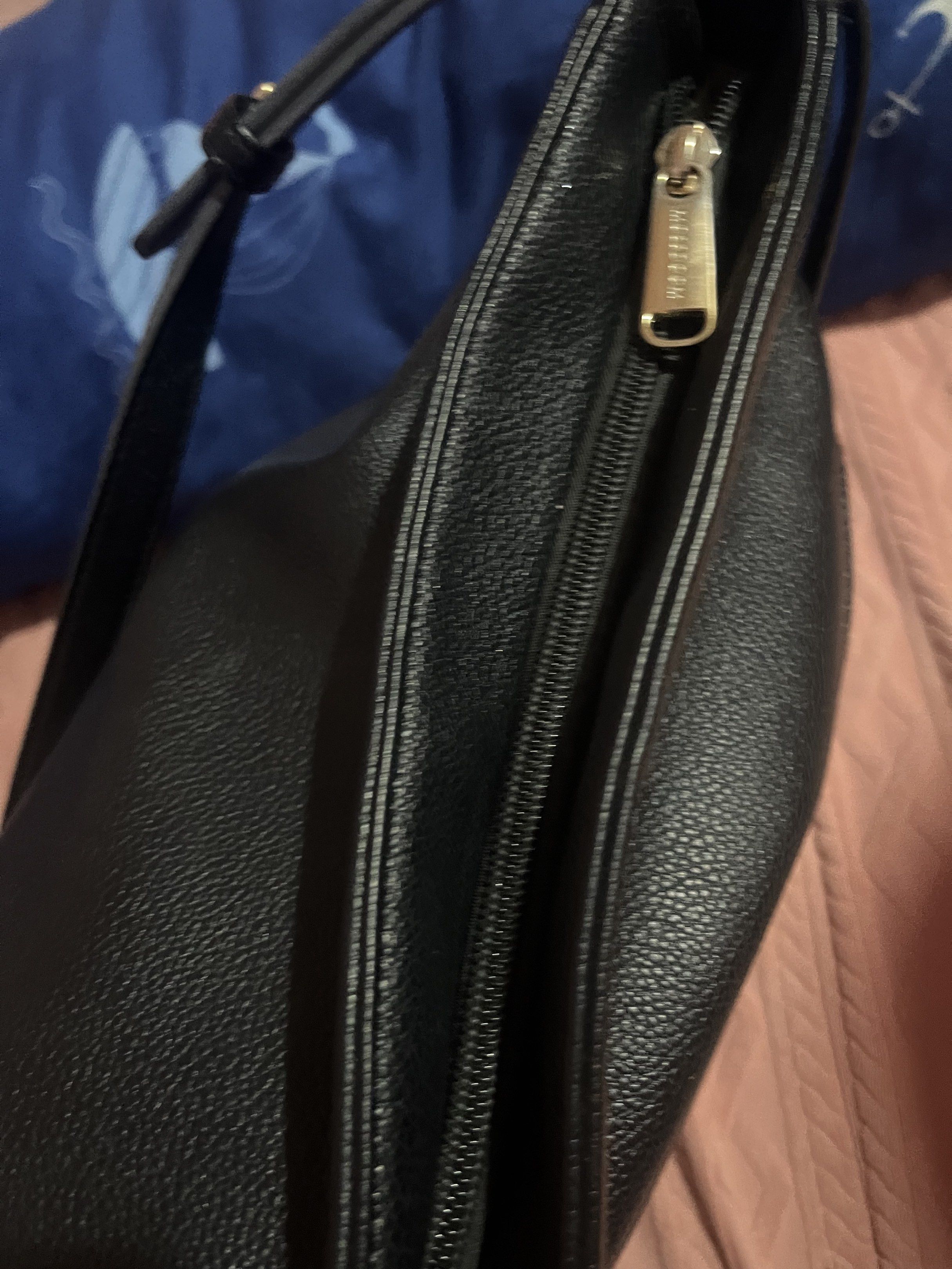 Mossdoom Black Shoulder Bag (Category: Luxury Bags & Wallets) located in Cabanatuan. Submitted by carou99645 (Listing ID 1420101707, Image 3). Description: - Black shoulder bag - Top handle - Main compartment with zipper - Interior pocket - Gold-tone logo - Brand tag - Textured exterior.