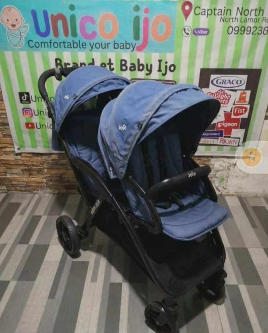 Joie Double Stroller (Category: Strollers) located in Caloocan City. Submitted by Unicoijo02 (Listing ID 1419978360, Image 1). Description: - Joie double stroller - Blue canopy - Comfortable seating area - Sleek black frame - Designed for convenience.