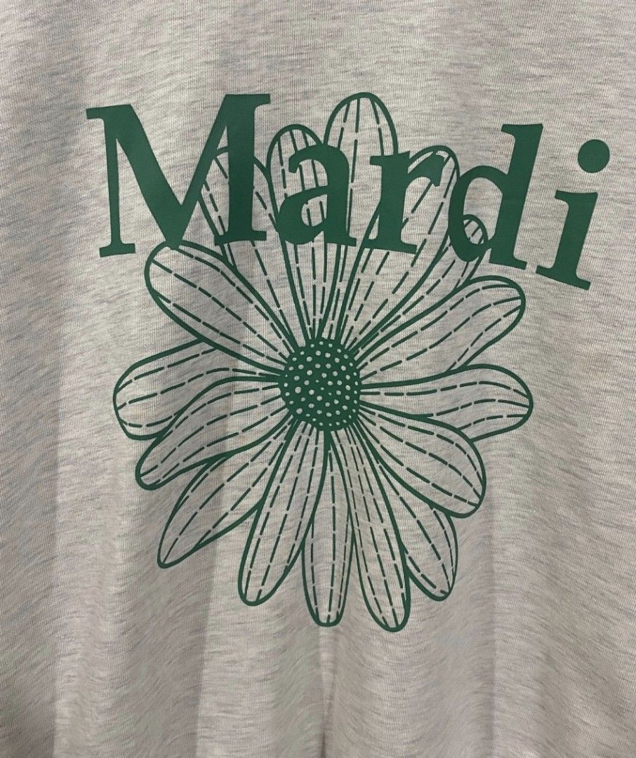 Mardi Sweatshirt Oatmeal Green (Category: Coats, Jackets and Outerwear) located in Muntinlupa City. Submitted by glittery.ph (Listing ID 1420082072, Image 2). Description: Mardi Mercredi sweatshirt in oatmeal green with a large green daisy graphic. Features the brand name "Mardi" above the flower. Made of 100% cotton. Free size with a length of 63cm, shoulder width of 62cm, chest of 65cm, and sleeve length of 54cm. The item is sold out on the off