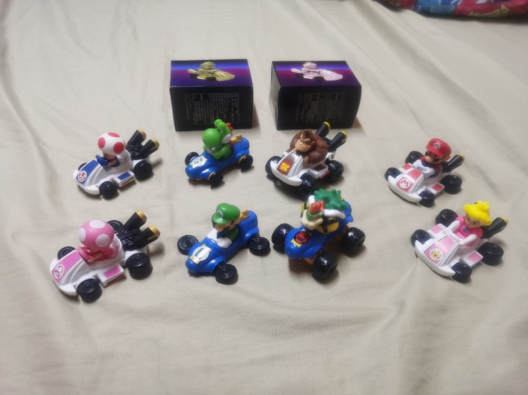 Various McDonalds Happy Meal Toys (Category: Character Goods) located in Manila. Submitted by tabitabz (Listing ID 1419994094, Image 3). Description: For Sale as set only Mario Kart Happy Meal, already applied stickers to all the toys except for the GOLD mario and SILVER peach (Unopened). Spiderman Brand New Day backpack launcher - P 100.00/pc or 250/set of 4 Spiderman figures SET of 4- BIB, no modifications made, used for display only - P 1,200.