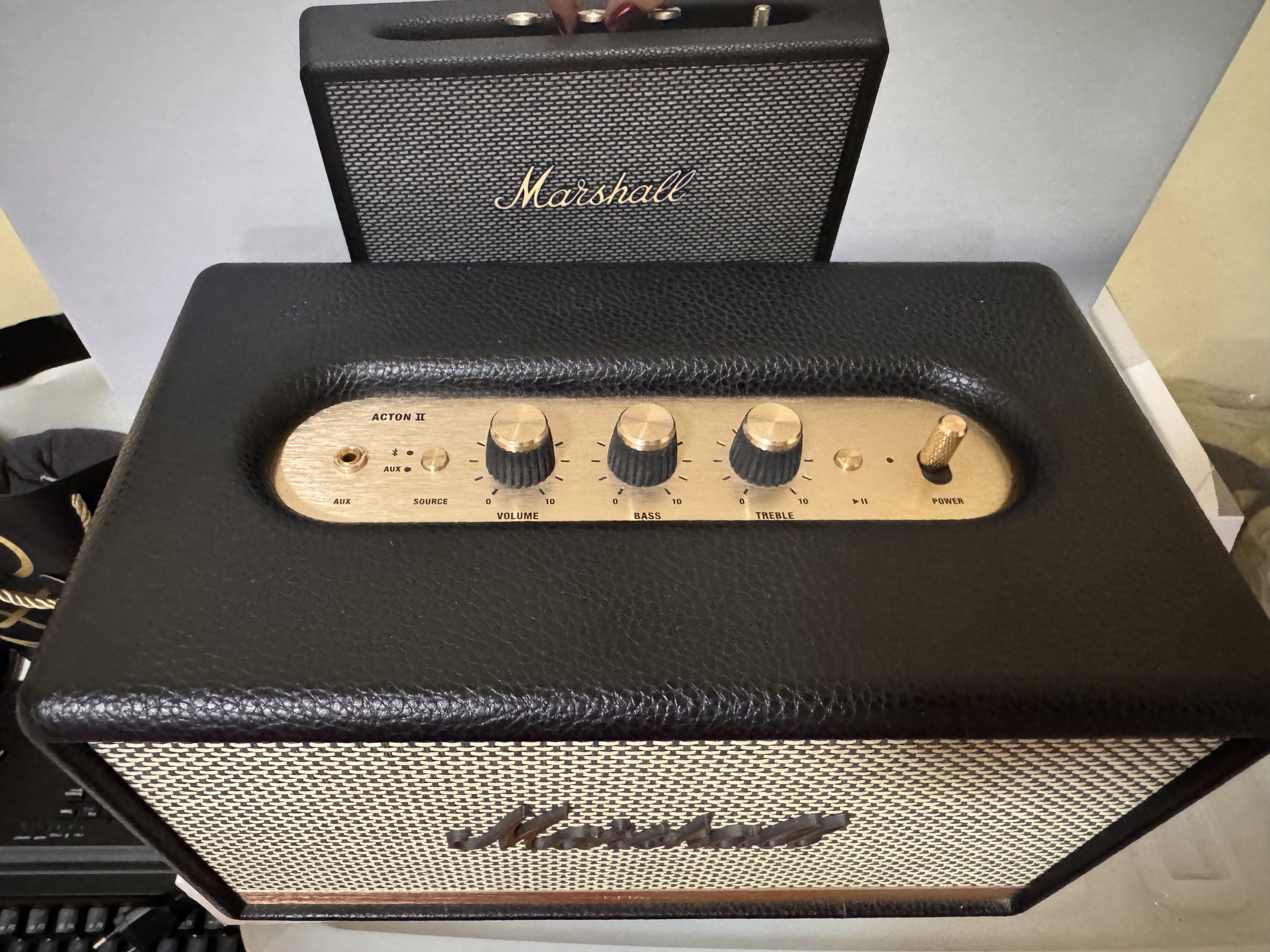Marshall Acton II Bluetooth Speaker (Category: Soundbars, Speakers & Amplifiers) located in Manila. Submitted by ydnar.ph (Listing ID 1420087836, Image 2). Description: Marshall Acton II Bluetooth speaker delivers powerful sound in a compact design. It features Bluetooth connectivity for wireless music streaming. The speaker has volume, bass, and treble controls for sound customization. It also includes an AUX input for wired connections. The spe