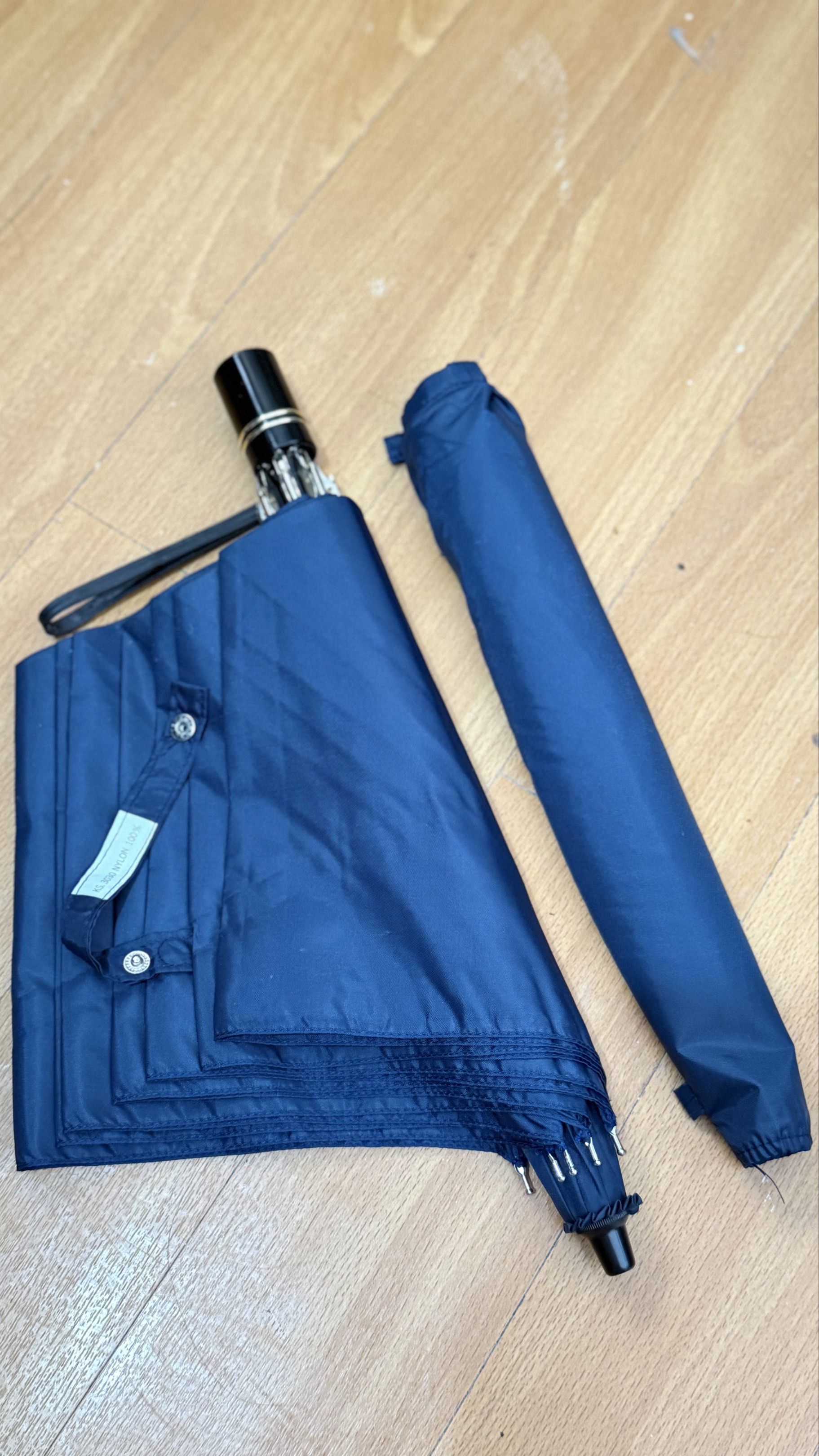 Navy Blue Foldable Umbrella (Category: Umbrellas) located in Naga. Submitted by JapaNix (Listing ID 1420054560, Image 1). Description: Japan Umbrella -windproof - Navy blue foldable umbrella - Black handle with wrist strap - Durable metal frame - Classic design - Provides rain and sun protection - Compact when folded.