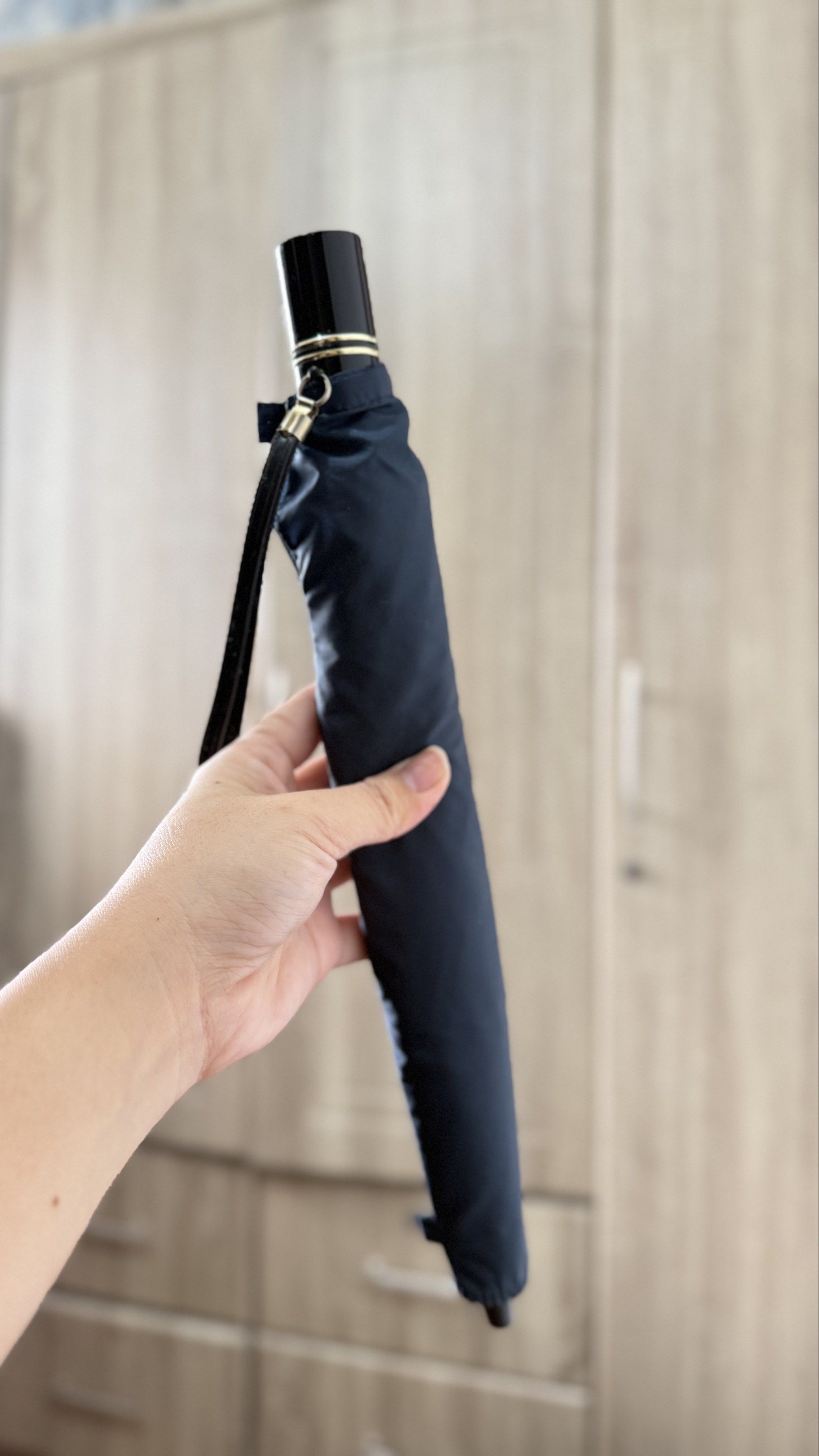 Navy Blue Foldable Umbrella (Category: Umbrellas) located in Naga. Submitted by JapaNix (Listing ID 1420054560, Image 3). Description: Japan Umbrella -windproof - Navy blue foldable umbrella - Black handle with wrist strap - Durable metal frame - Classic design - Provides rain and sun protection - Compact when folded.