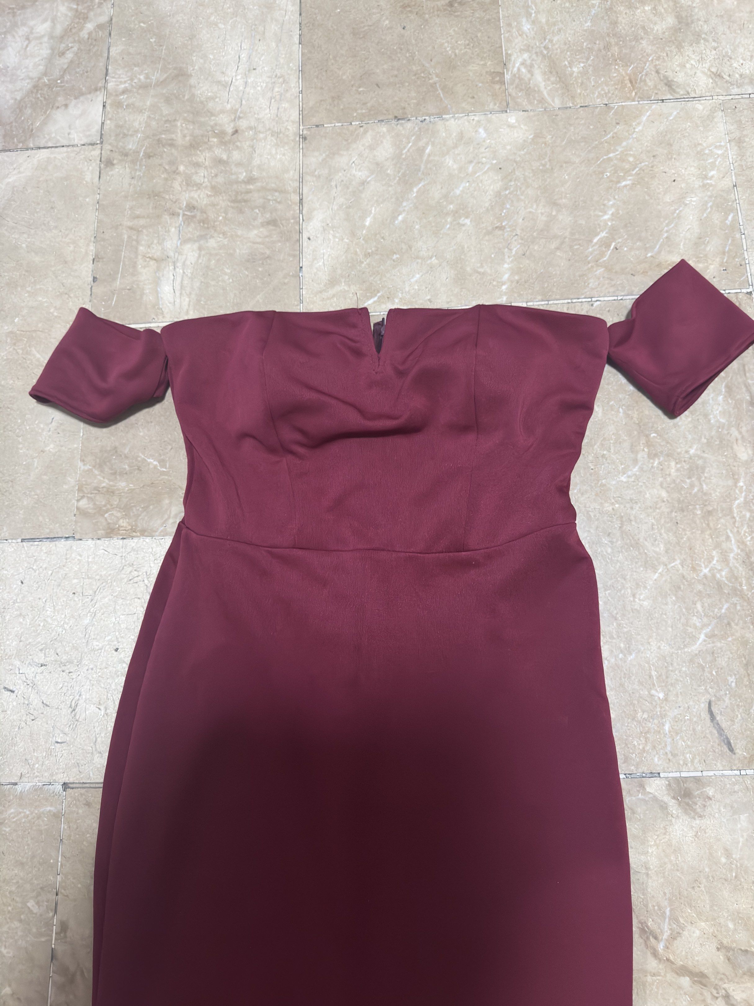 Off-Shoulder Long Mermaid Evening Dress (Category: Dresses) located in Marikina City. Submitted by chiigrmz (Listing ID 1420111437, Image 2). Description: SIZE M on tag fits M-L -Elegant off-shoulder design - Stunning burgundy color - Flattering mermaid silhouette - Fitted bodice - Flowing mermaid hem - Perfect for formal occasions.