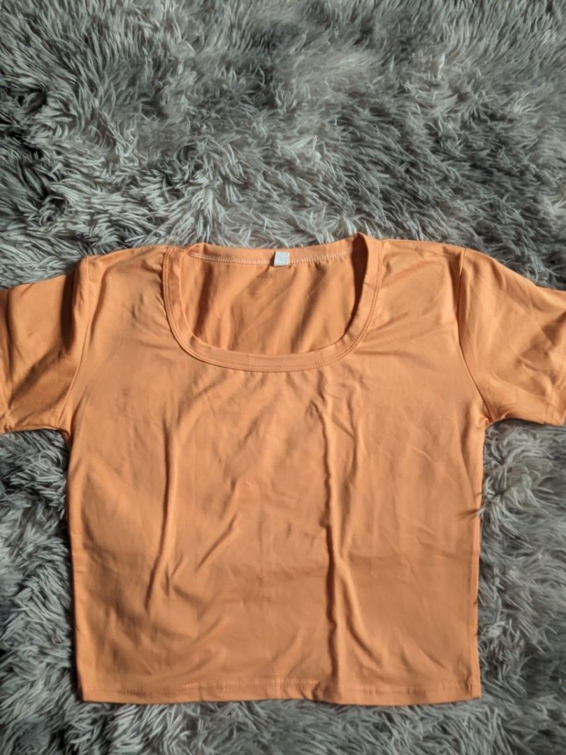Orange Crop Top (Category: Shirts) located in Santa Rita. Submitted by elixiriaz (Listing ID 1420002947, Image 1). Description: - Orange crop top - Scoop neckline - Short sleeves - Lightweight fabric - Ideal for warm weather - Versatile style - Pairs well with high-waisted bottoms - fits small to medium frame.