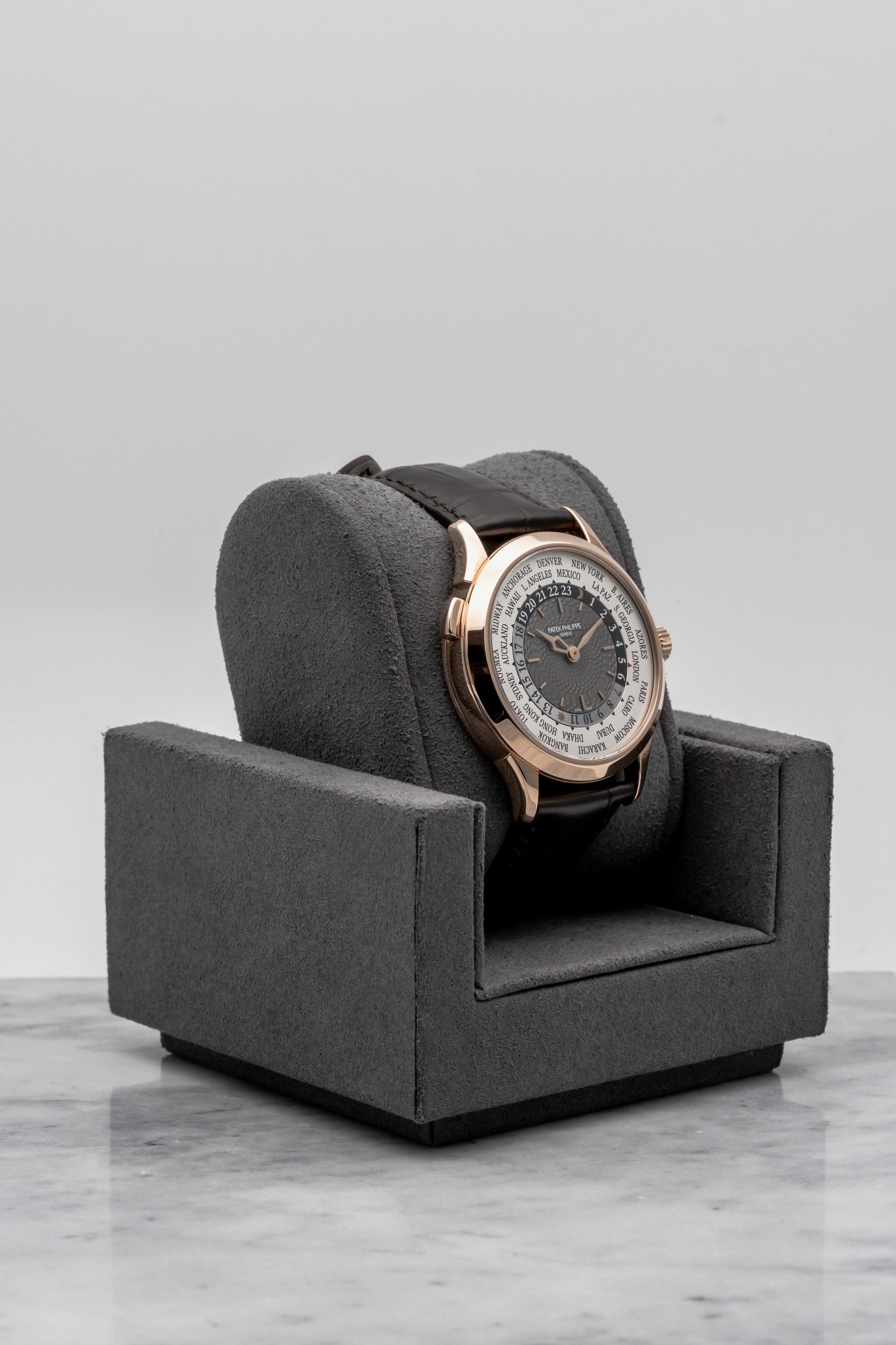Patek Philippe World Time 5230R-001, Grey Guilloché Dial • 2019 • 📦 & 📄 (Category: Watches) located in Singapore. Submitted by timetells (Listing ID 1420023281, Image 3). Description: Brand: Patek Philippe Model: World Time Reference Number: 5230R-001 Year: 2019 Case Size: 38.5 mm Case Material: 18K Rose Gold Dial: Charcoal Gray Lacquered Dial with Guilloché Center, Gold Applied Hour Markers, City Ring and 24-Hour Ring Strap: Dark Brown Leather