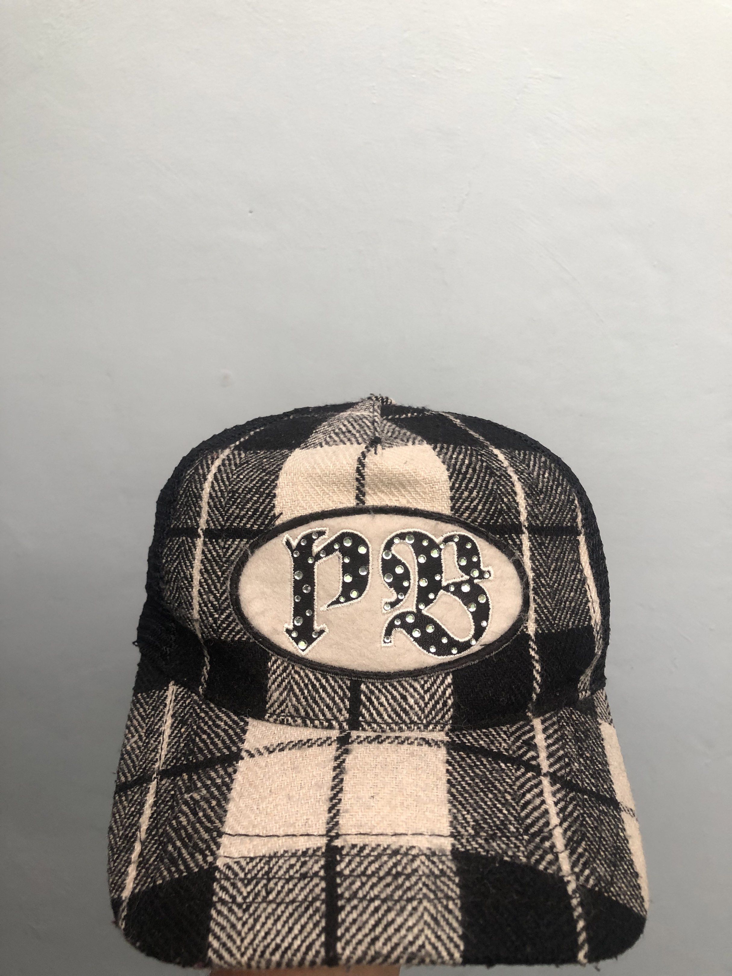 Playboy Rhinestone Cap (Category: Caps & Hats) located in Muntinlupa City. Submitted by afterclass_ph (Listing ID 1420023455, Image 1). Description: - Black mesh top - Black and white plaid brim - Button detail on top - Woven fabric - Brim with decorative text band needs wash and reshape.