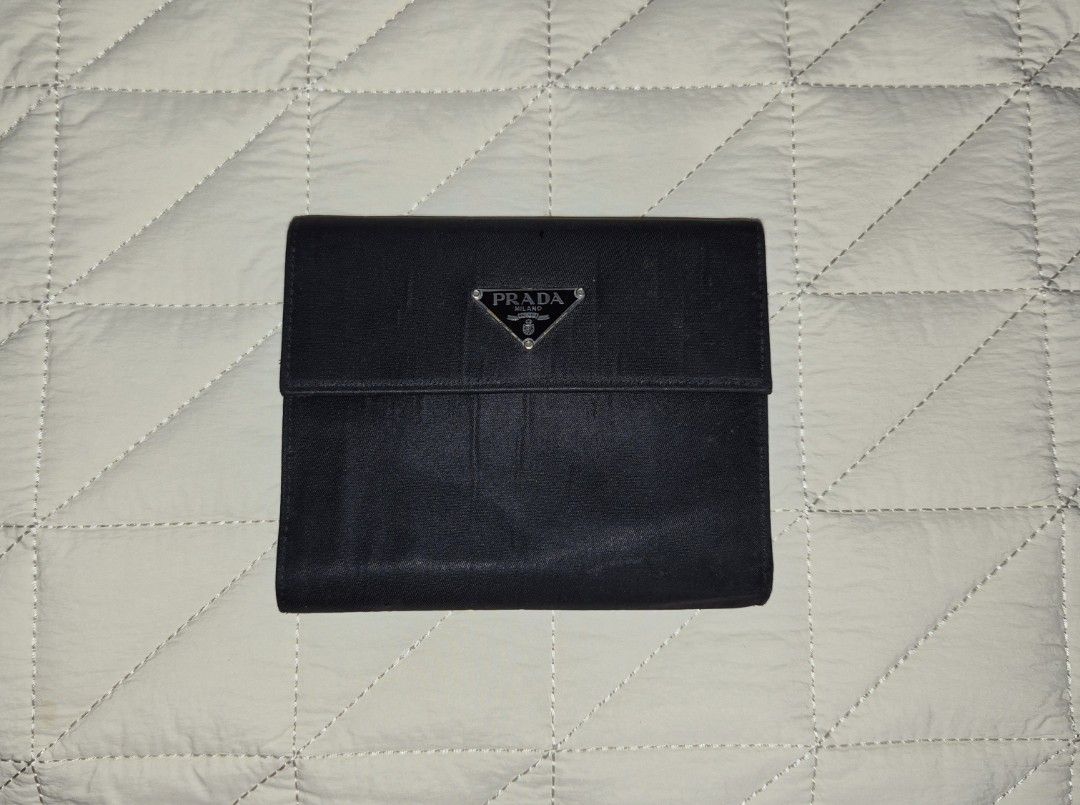 Prada Tri-Fold Wallet (Category: Luxury Bags & Wallets) located in Quezon City. Submitted by marya_s (Listing ID 1419982193, Image 1). Description: - Authentic Prada tri-fold wallet - Multiple card slots - Bill compartment - Snap closure coin pocket - Prada logo on front - nylon material BAWAL PO SA MASELAN ACTUAL PICS POSTED.
