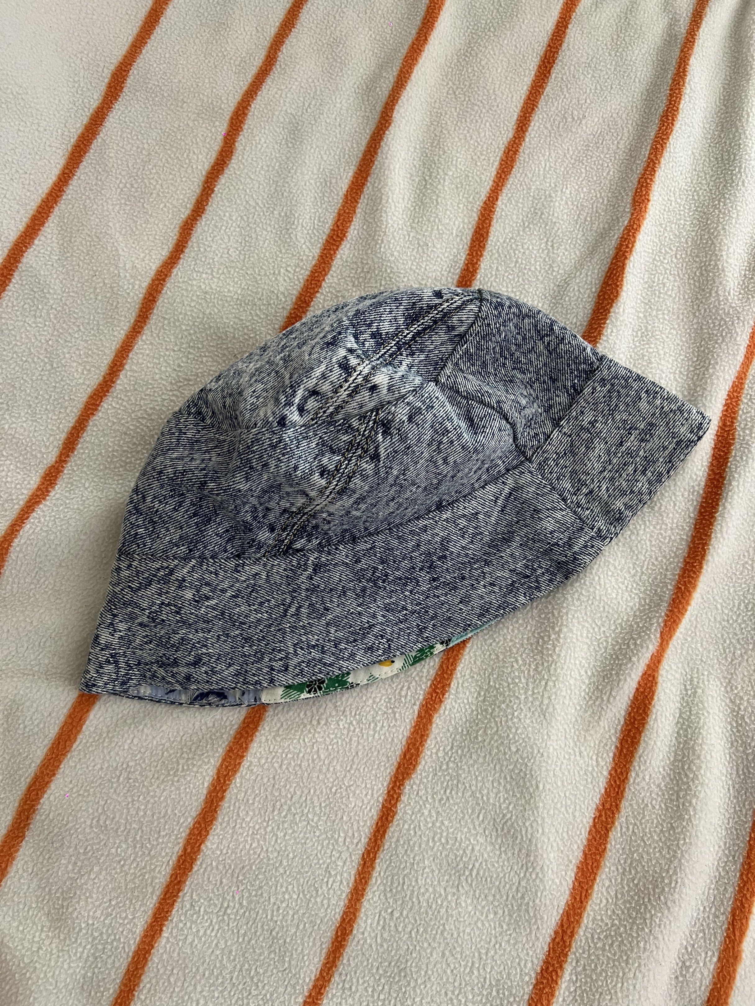 Reversible Patchwork Bucket Hat (Category: Babies & Kids Fashion) located in Singapore. Submitted by l0773 (Listing ID 1420006535, Image 1). Description: - Reversible design - One side: Denim wash - Other side: Colorful patchwork - Adds personality to your outfit - Provides sun protection - Stylish and versatile.