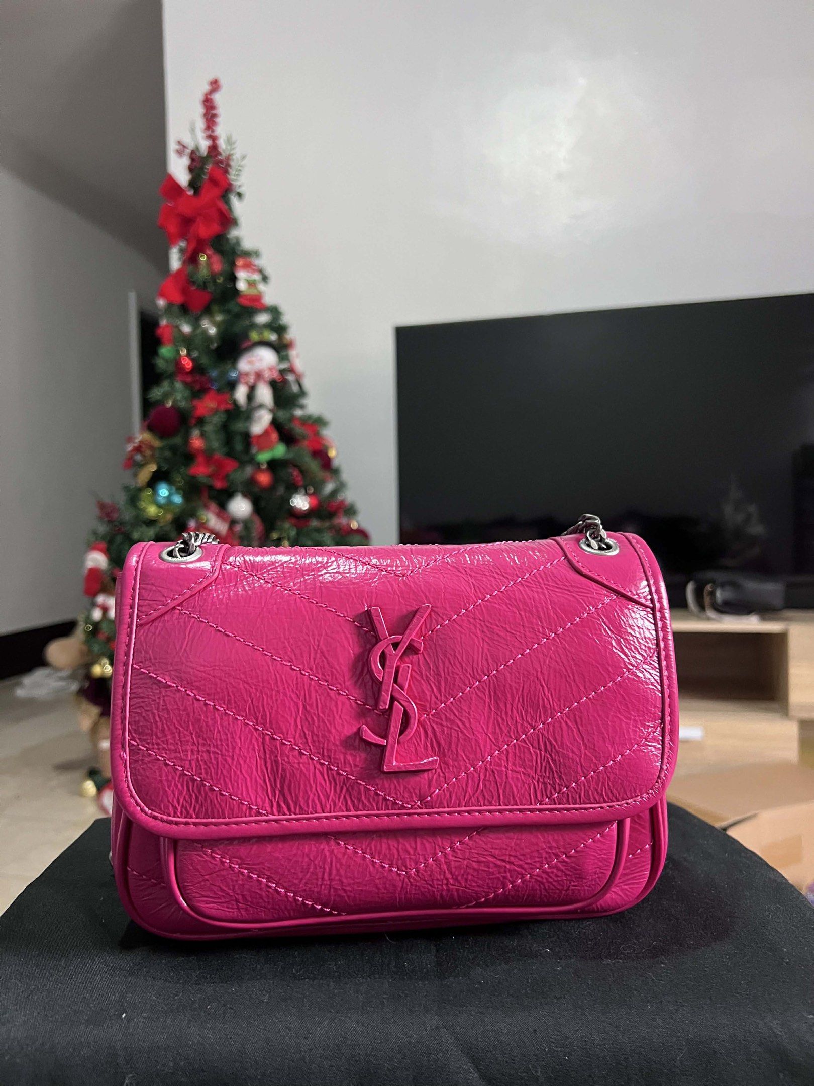 Saint Laurent Lou Mini Bag (Category: Luxury Bags & Wallets) located in Manila. Submitted by luxurytreasure.ph (Listing ID 1420046426, Image 1). Description: - Saint Laurent Lou Mini Bag - Vibrant pink color - Quilted design - Iconic YSL logo - Chain strap - Flap closure - Interior label: Saint Laurent Paris (Made in Italy) - Stylish and compact size.