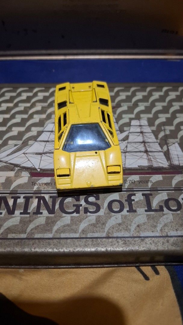 Sakura Lamborghini Countach 1/43 Super Car (Category: Vehicle & Diecast Models) located in Antipolo. Submitted by goldentiger-ac44 (Listing ID 1420042438, Image 1). Description: - Sakura Lamborghini Countach toy car - 1/43 scale - Made in Japan - Features black wheels - Detailed engine compartment - Doors can be opened - Shows some wear and tear.