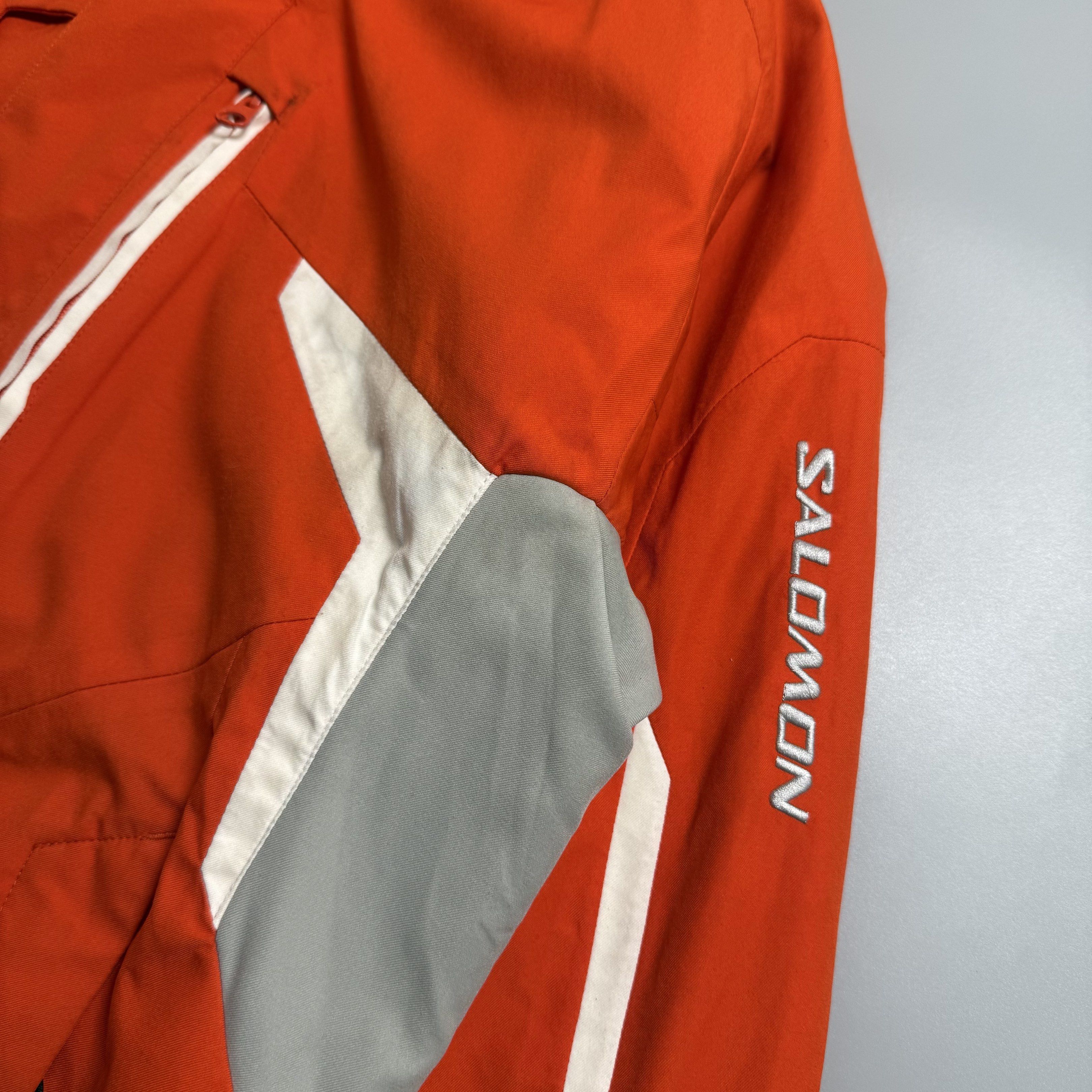 Salomon Insulated Ski Jacket w/ RECCO (Category: Coats, Jackets and Outerwear) located in Cebu City. Submitted by inukaybyjlf (Listing ID 1420114516, Image 3). Description: Authentic Salomon performance winter jacket Bright orange technical ski jacket featuring full insulation, fixed hood, powder skirt, ventilation zips, multiple functional pockets, and built-in RECCO avalanche rescue reflector. Designed for alpine skiing & snowboarding. Warm, du