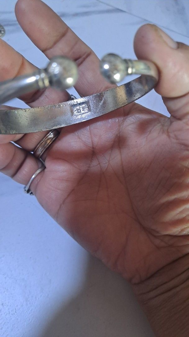 Silver tone Bangle Bracelet (Category: Bracelets) located in Davao. Submitted by bravemoon_556cd5 (Listing ID 1419988833, Image 2). Description: - Silver bangle bracelet - Engraved design - Rounded shape with ball ends - Features markings on the inside - Perfect for everyday wear.
