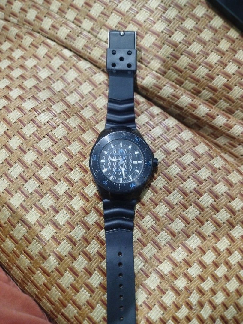 Technomarine Sea Manta Automatic Watch (Category: Men's Watches) located in Subic. Submitted by regiedaniel01 (Listing ID 1420010142, Image 3). Description: Technomarine Sea Manta automatic watch with a black dial and blue accents. Features a date display and a rotating bezel. The watch has a black rubber strap. The back of the watch shows the automatic movement. The watch is marked with "Stainless Steel" and "Automatic Movement"..