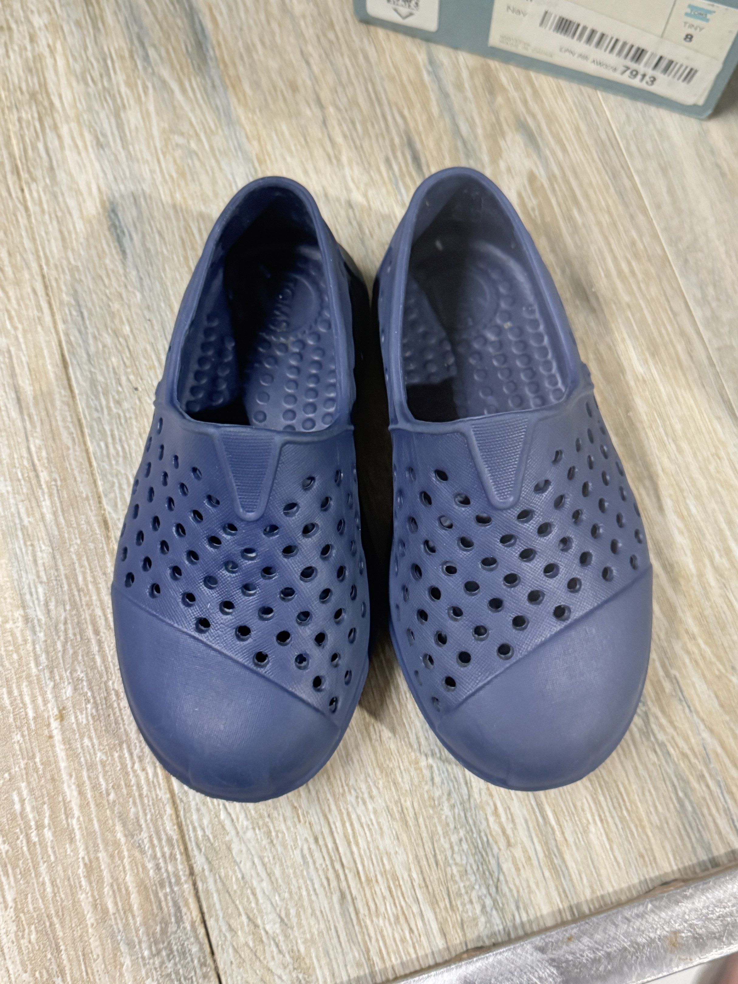 TOMS Romper Navy Shoes - Size 8 (Category: Babies & Kids Fashion) located in Pasig City. Submitted by mco2223 (Listing ID 1420018129, Image 1). Description: - TOMS Ronper shoes - Navy blue, size 8 - Slip-on style - Perforated design - White, textured soles - Includes original box - Made in China.