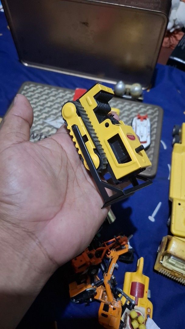Tonka Bulldozer Toy (Category: Vehicle & Diecast Models) located in Antipolo. Submitted by goldentiger-ac44 (Listing ID 1420040122, Image 3). Description: - Classic Tonka bulldozer toy - Bright yellow color - Features black tracks and frame - Made of durable metal and plastic - Tonka logo visible - Great toy for children.