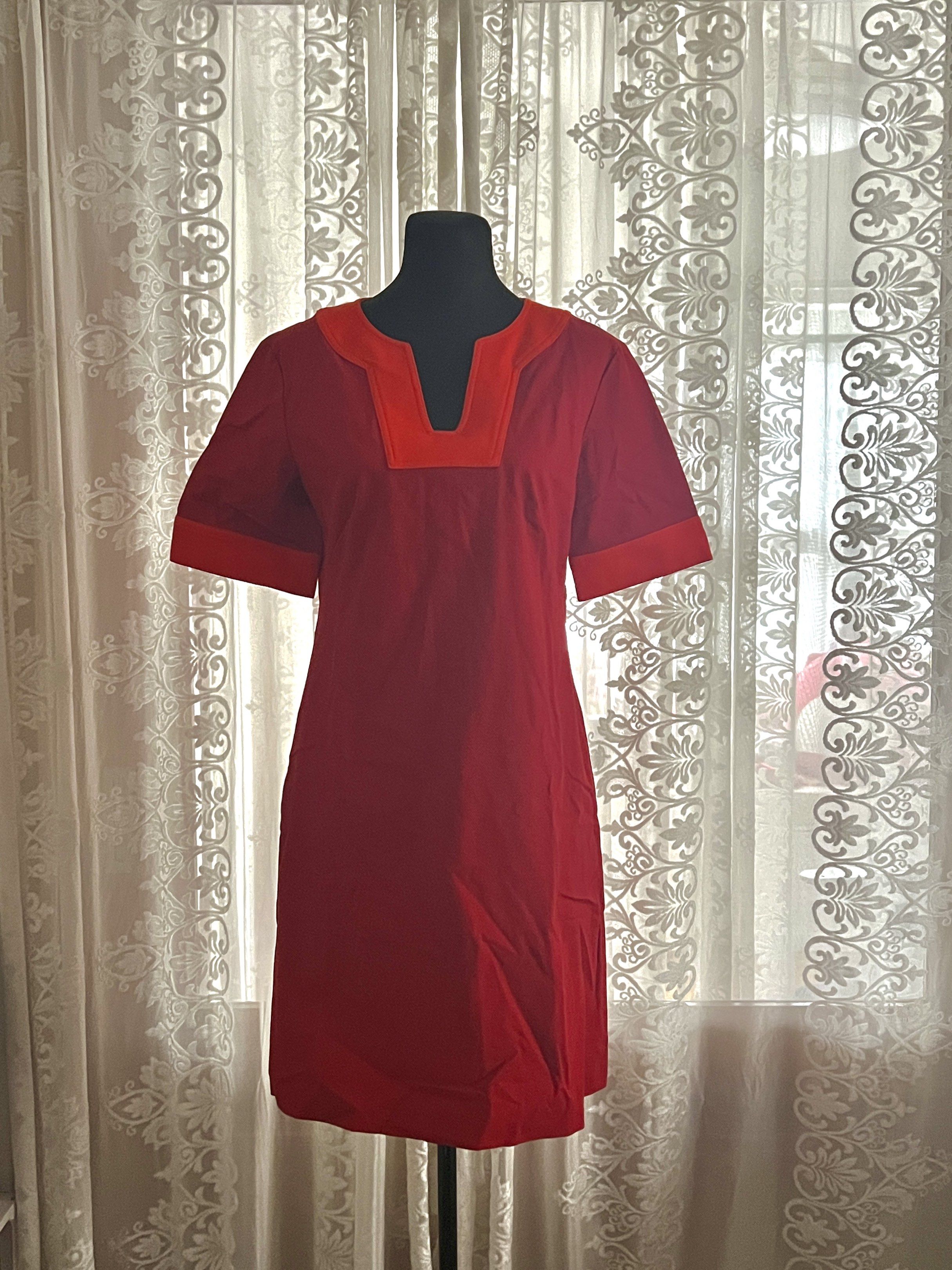 Tory Burch Red Contrast Trim Shift Dress (Category: Dresses) located in Manila. Submitted by soukcasa (Listing ID 1420025410, Image 1). Description: Size👚: M Brand🛒: Tory Burch Conditon🛍️: Never worn. RFS👜: Doesn’t fit Elevate your wardrobe with this timeless Tory Burch piece! Featuring a vibrant red hue with chic ontrast paneling on the neckline and sleeves, this dress offers a polished, mod-inspired silhouette that transitions perfectly fro