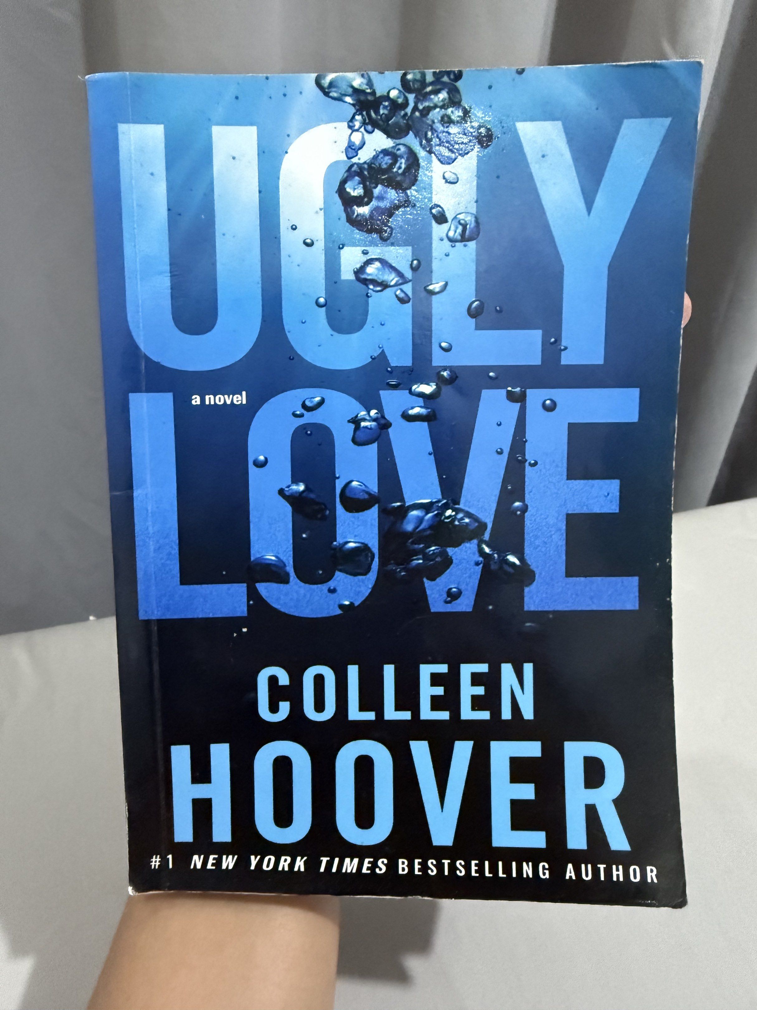 Ugly Love by Colleen Hoover (Category: Storybooks) located in Mansalay. Submitted by declutterandco (Listing ID 1420112439, Image 1). Description: - Title: "Ugly Love" - Author: Colleen Hoover - Genre: Novel - New York Times Bestselling Author - Cover: Blue with white lettering.