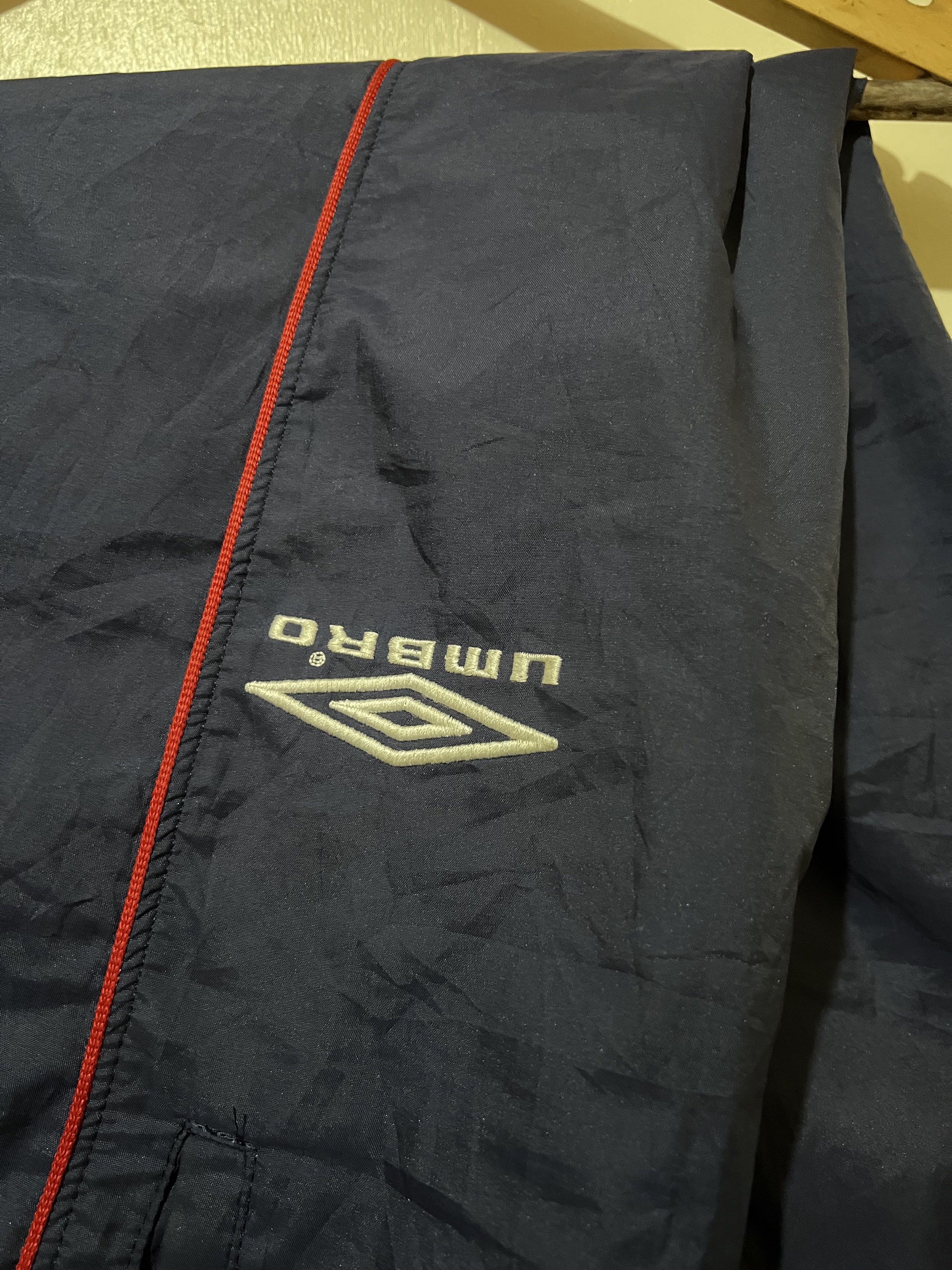 Umbro Navy Track Pants (Category: Joggers) located in Baguio. Submitted by jsanteli1738 (Listing ID 1420147356, Image 3). Description: - Vintage Navy blue Umbro track pants - Embroid Logo Design - Elastic waistband with drawstring - Zippered ankles - Umbro logo on left leg - Baggy pants needs wash only Width 30 up free size with drawstrings, Length 43, Thigh 12, Hem:9.
