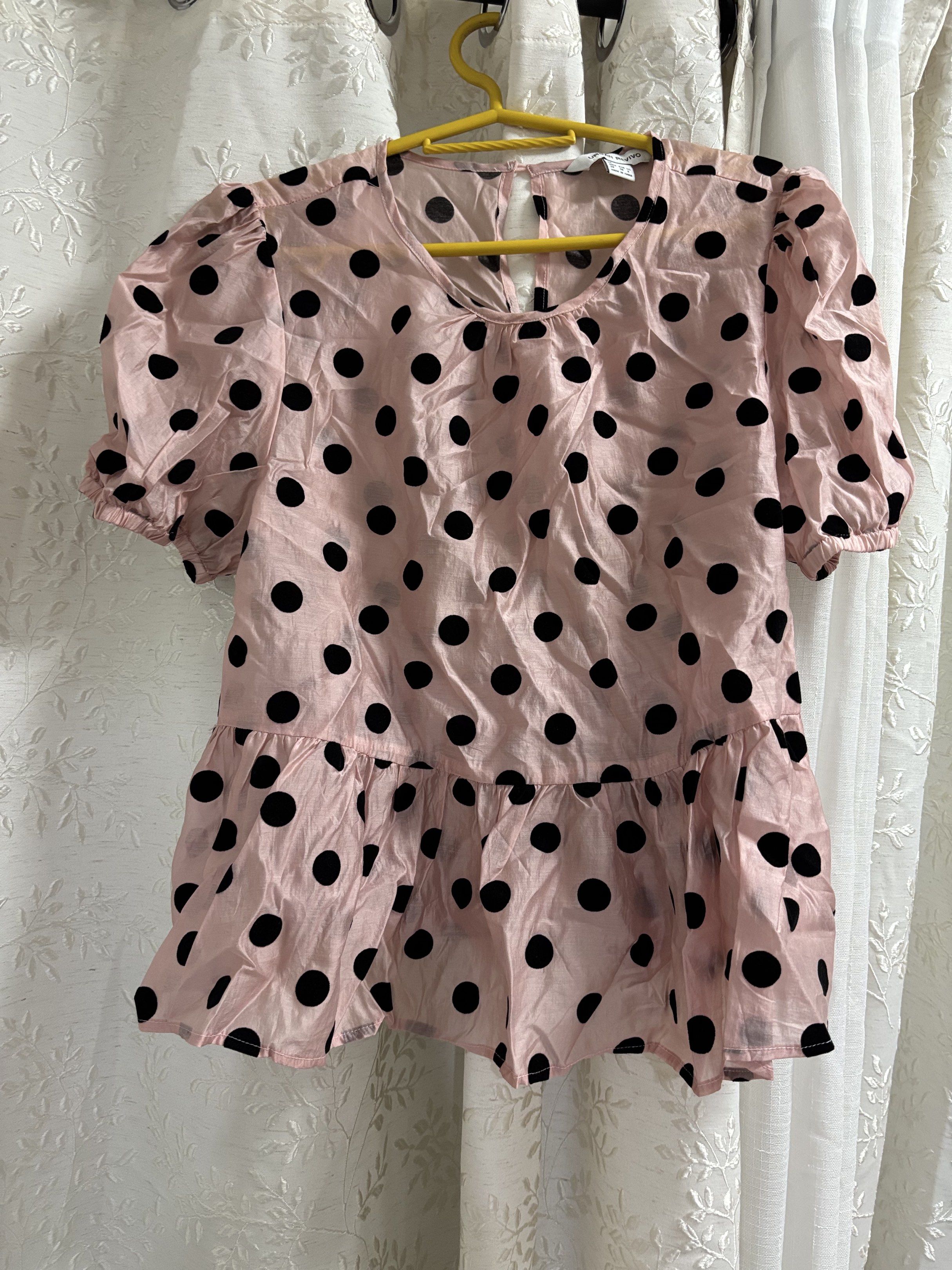 Urban Revivo Polka Dot Top (Category: Blouses) located in Pasig City. Submitted by eloisyy_declutter (Listing ID 1419984247, Image 1). Description: - Urban Revivo top - Pink base with black polka dots - Features short, puffed sleeves - Stylish peplum hem - Keyhole detail at the back - Size: M Never used.