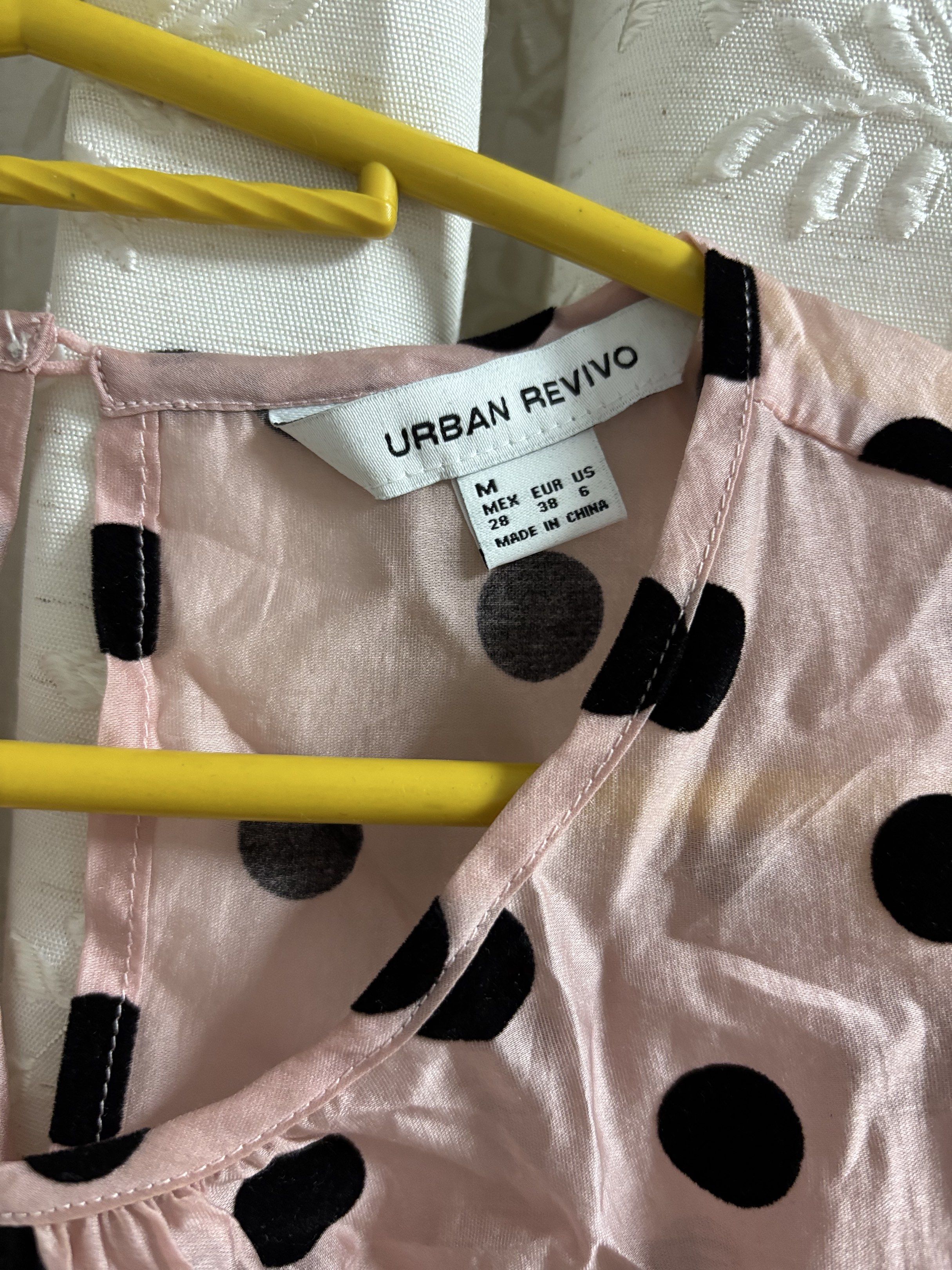 Urban Revivo Polka Dot Top (Category: Blouses) located in Pasig City. Submitted by eloisyy_declutter (Listing ID 1419984247, Image 2). Description: - Urban Revivo top - Pink base with black polka dots - Features short, puffed sleeves - Stylish peplum hem - Keyhole detail at the back - Size: M Never used.